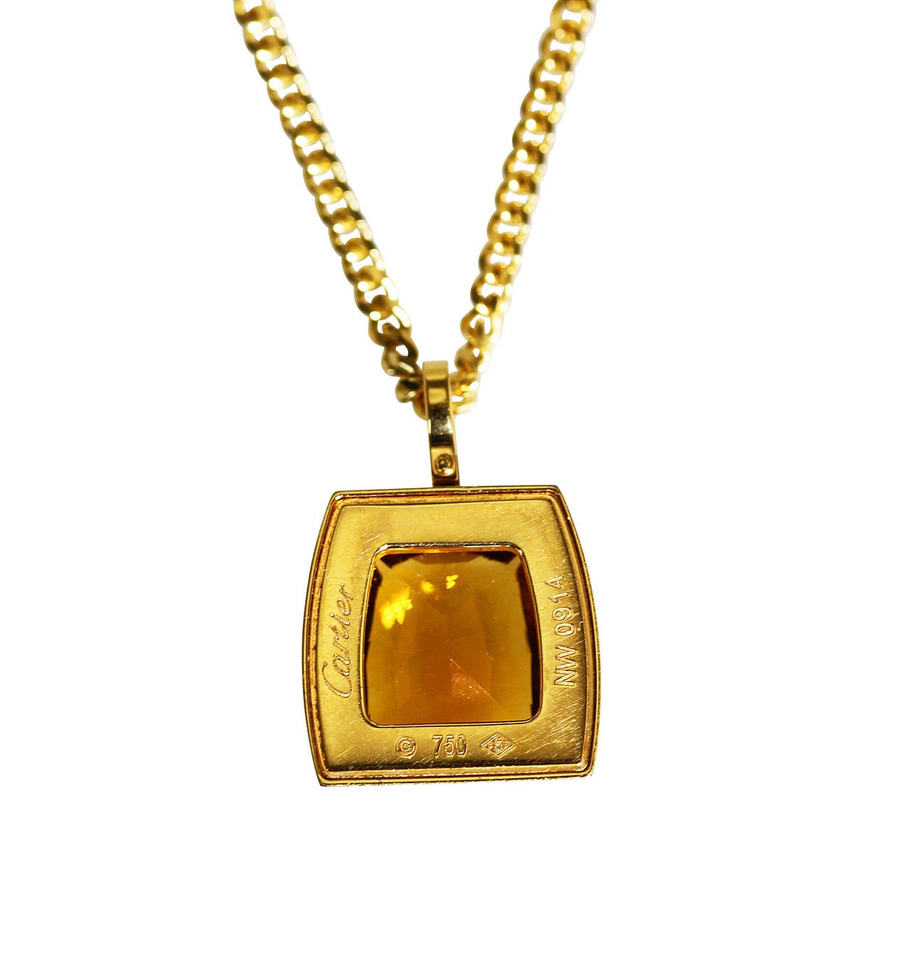 An 18 karat yellow gold, citrine and diamond pendant by Cartier, the pendant bezel set with a fancy-cut citrine weighing 5.00 carats, framed by 43 round diamonds weighing approximately 0.30 carat, gross weight 14.6 grams, signed Cartier, numbered