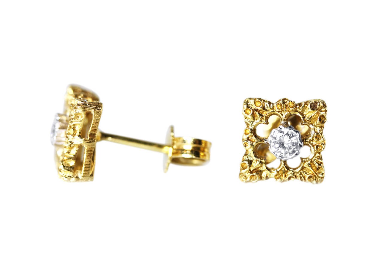 A lovely pair of 18 karat yellow gold and diamond stud earrings by Buccellati, designed as openwork square plaques set in the centers with 2 round diamonds weighing approximately 0.15 carat, gross weight 3.0 grams, measuring 1/4 by 1/4 inch, signed