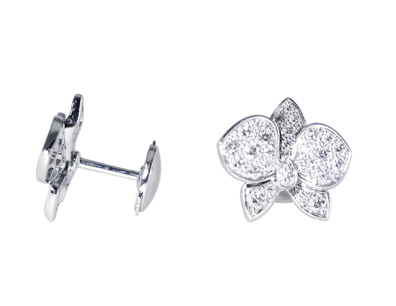 A pair of 18 karat white gold and diamond 'Orchid' Earrings by Cartier, designed as orchid flowerheads set with 54 round diamonds weighing approximately 1.10 carats, gross weight 4.7 grams, measuring 1/2 by 1/2 inch, signed Cartier, numbered YS9363,