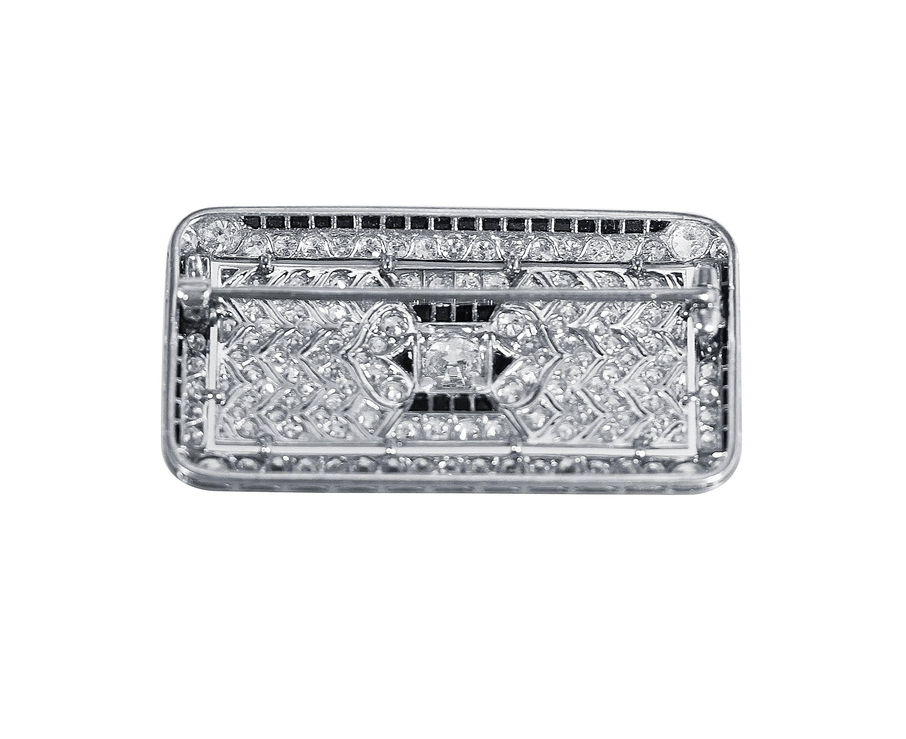 Art Deco Platinum, Diamond and Onyx Brooch by Cartier, 1924
• Unsigned, numbered 1637
• Accompanied by Cartier Valuation for Insurance stating that the brooch is by Cartier, New York, 1924
• 147 old cut round diamonds approximately 3.50 carats
•