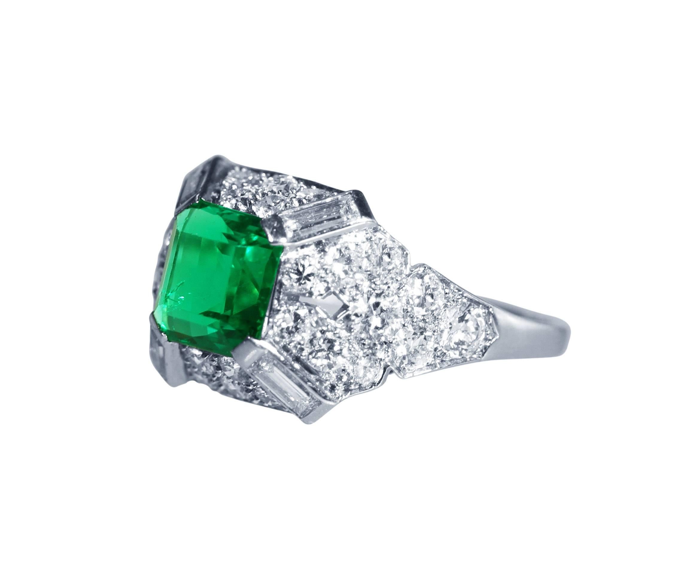 Art Deco platinum, emerald and diamond ring, set in the center with an exceptional natural emerald-cut emerald weighing approximately 1.90 carats, accented by 30 round diamonds weighing approximately 1.75 carats, further set with 4 baguette diamonds