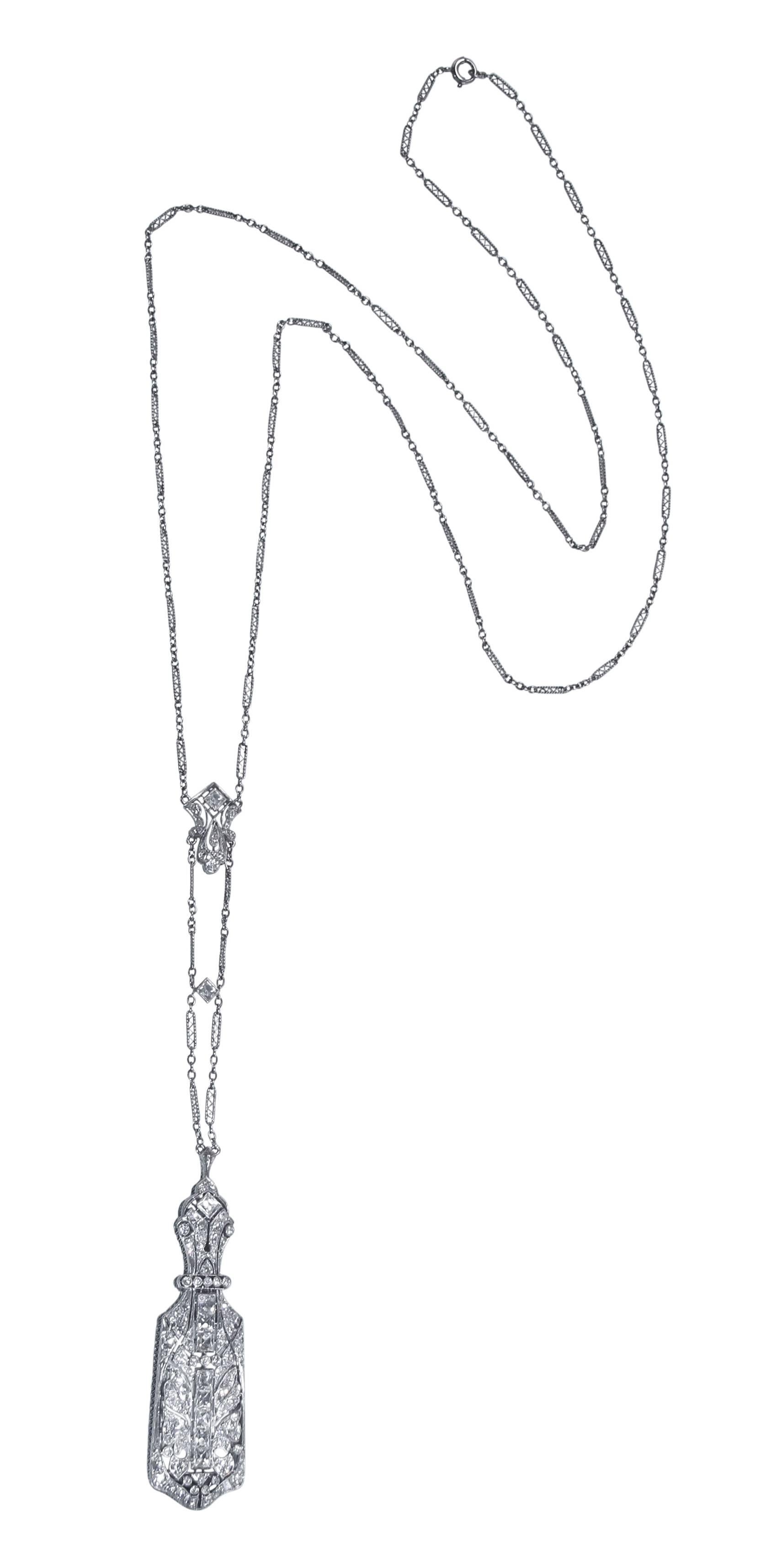 Art Deco platinum and diamond lorgnette longchain, designed as an openwork rectangular plaque with the reverse opening to reveal a pair of reading glasses all suspended from an ornate plaque link chain, set with 11 French-cut diamonds weighing
