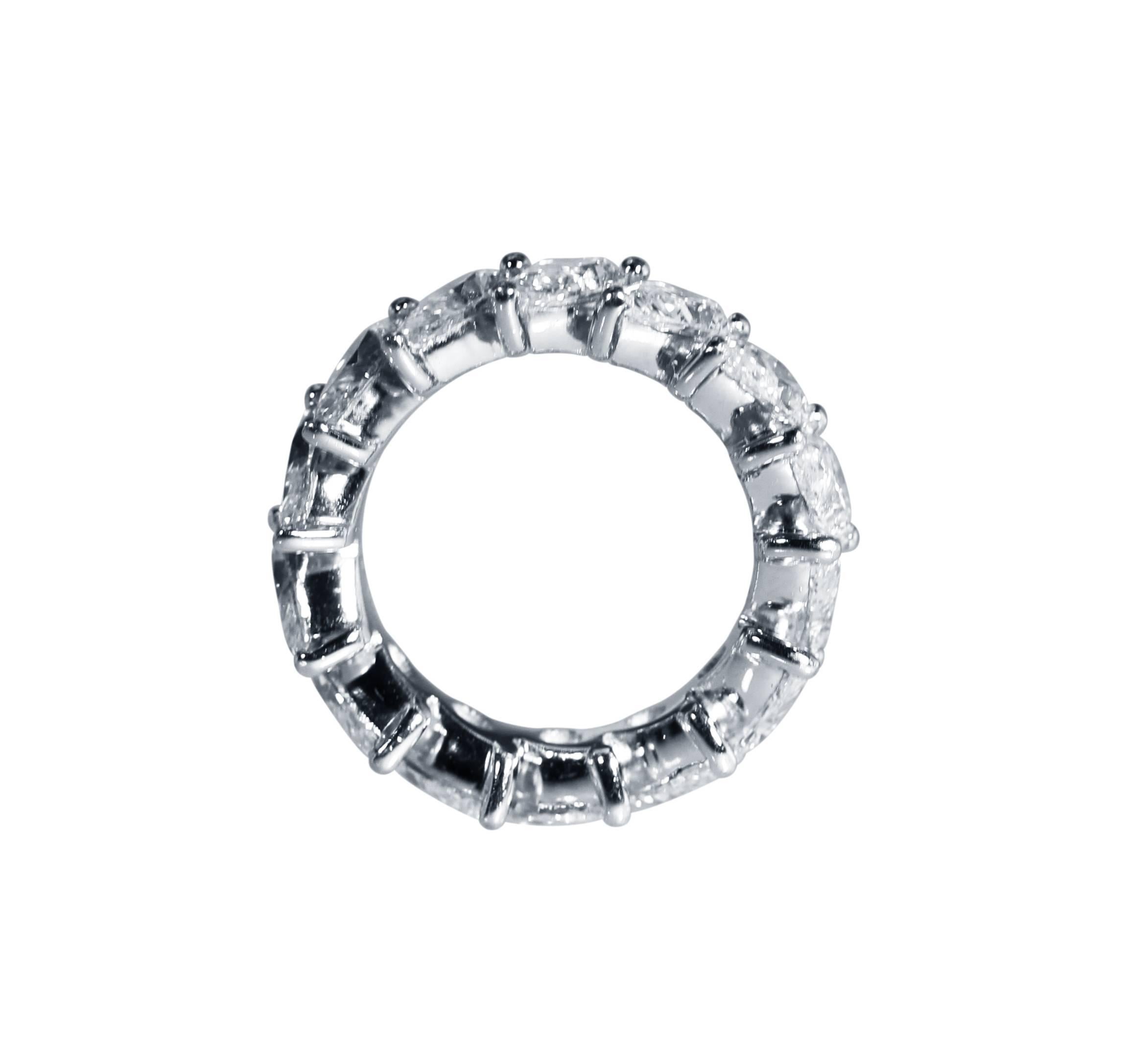 A platinum and diamond eternity band ring by Graff, set at an angle with 14 pear-shaped diamonds weighing 7.36 carats, gross weight 10.3 grams, size 5 3/4, signed Graff, numbered 9262.
Accompanied by Insurance Appaisal Document from Graff at 61,000