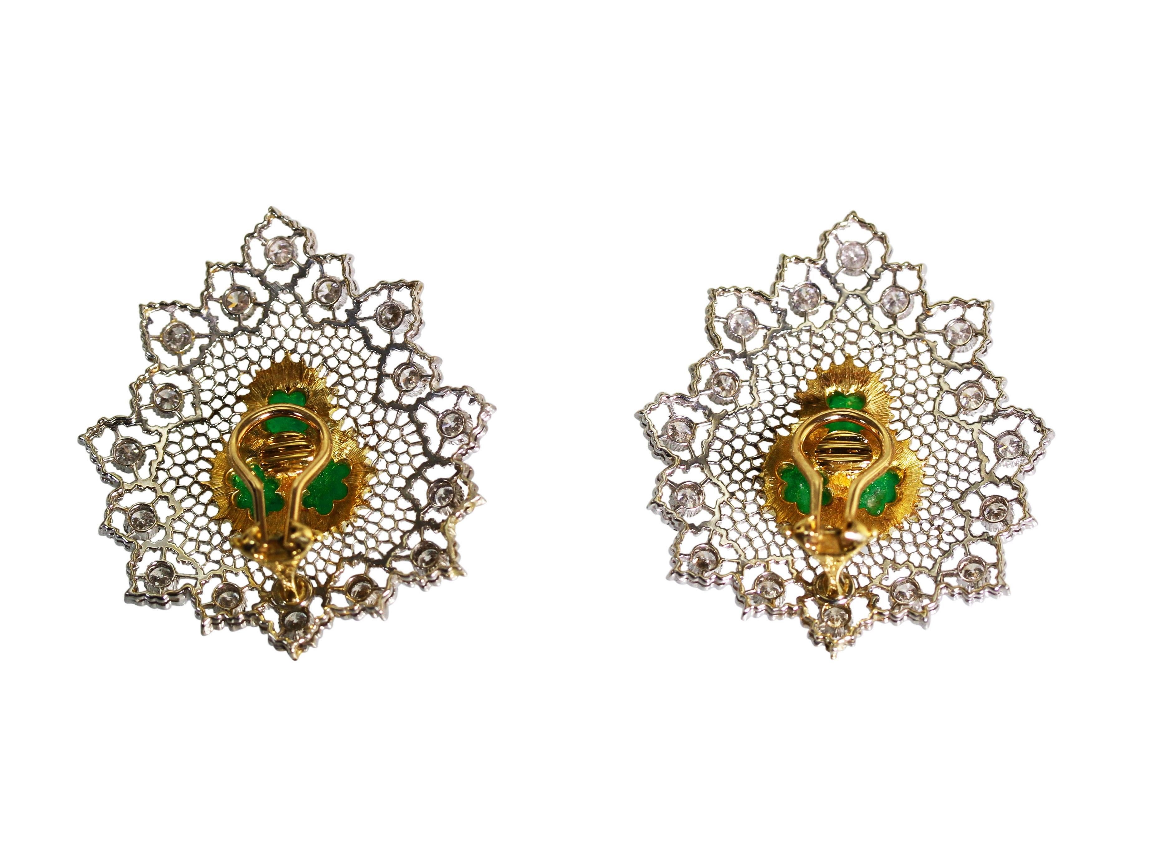 Made by the incredible Italian jewelry firm Buccellati, these earclips feature vivid green cabochon emeralds set within lace-like frames of yellow and white gold set with round diamonds weighing a total of approximately 2.00 carats.  A beautiful