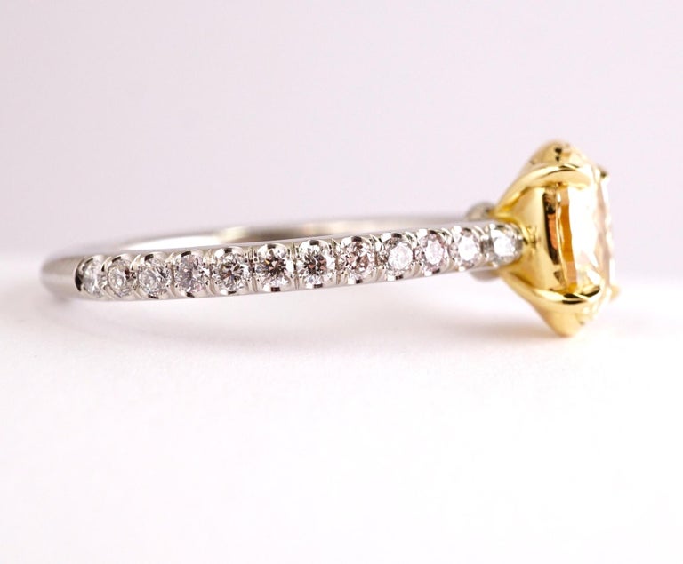 Contemporary Fancy Yellow 1.12 Carat Oval Cut Diamond Engagement Platinum Ring