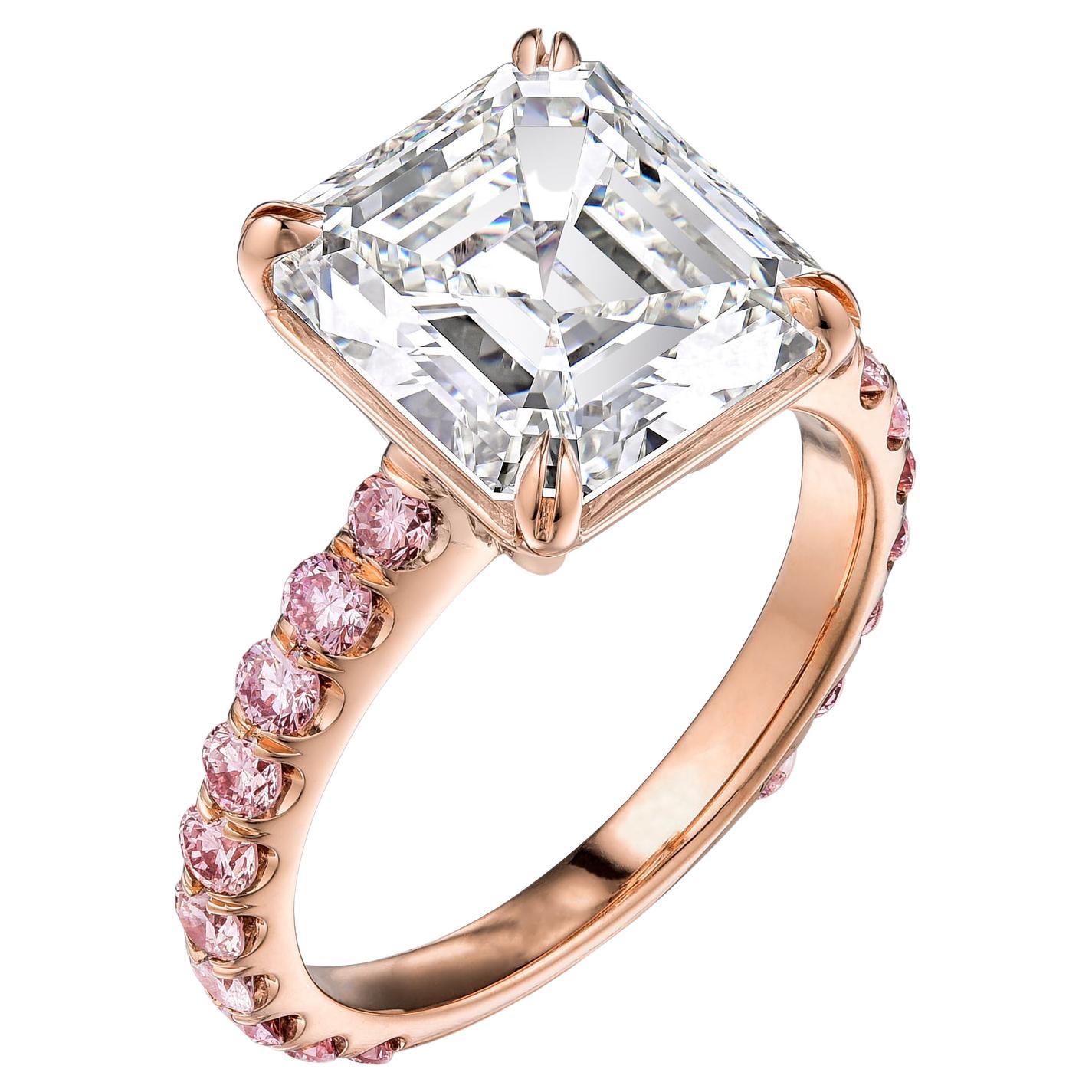 Diamond engagement ring set in 14K pink gold with GIA certificate, no. 2131165653. Details are: Center stone: 4.54ct / J VS2 Asscher/ square emerald cut diamond with fancy light pink diamonds 3/4 way along shank. Center stone dimensions: 10.02 x