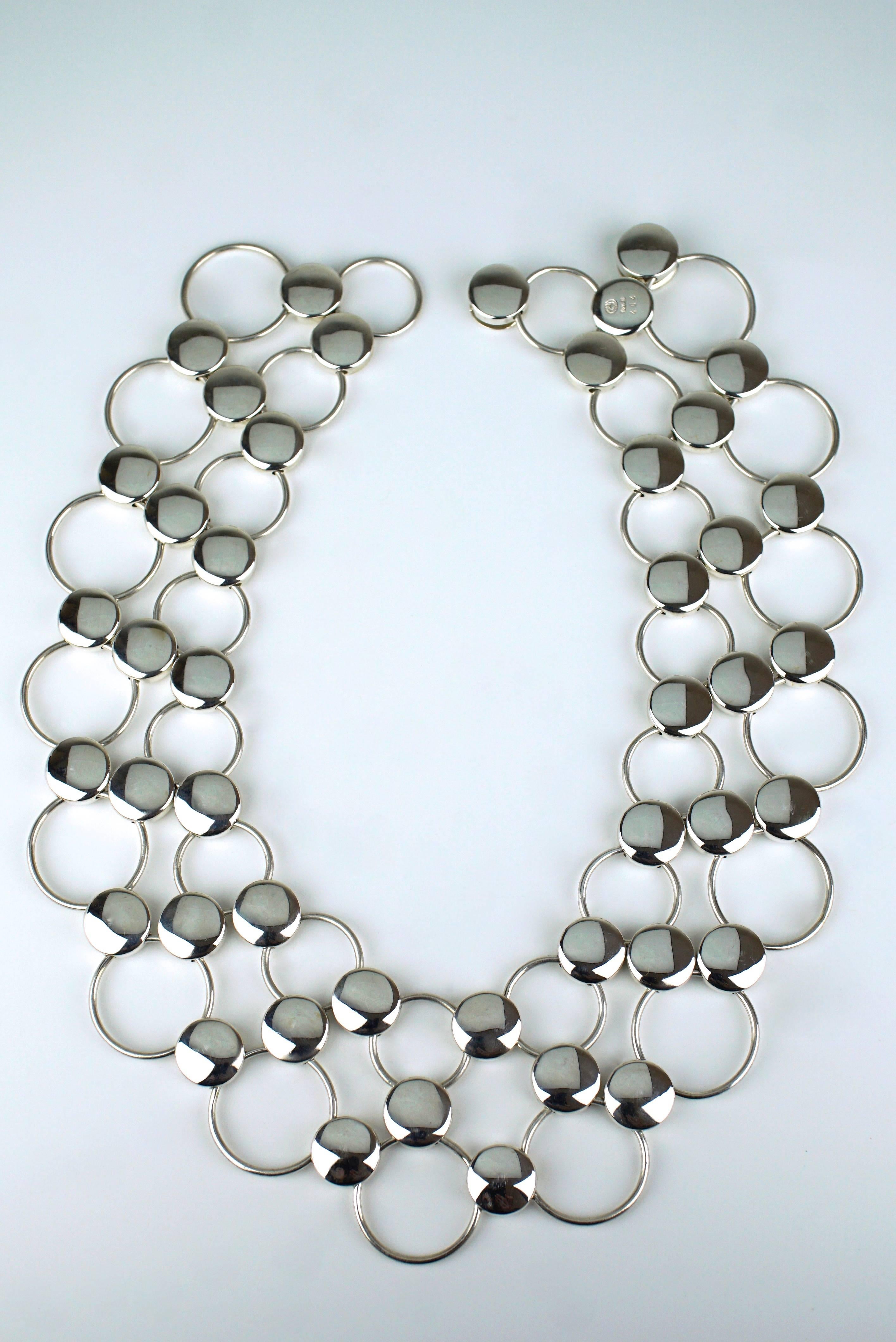 A solid silver dot and ring necklace - a multi row collar of alternating solid dots and open rings forming a flexible collar 

- marked with post 1945 marks for Georg Jensen of Copenhagen
- design number 464 by Regitze Overgaard 
- total weight