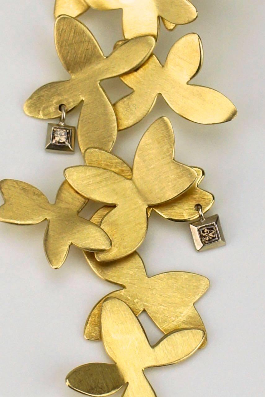 Modern H.Stern 18k yellow gold and diamond flower drop earrings