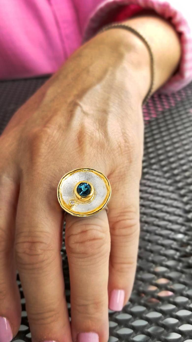 Contemporary Yianni Creations Blue Topaz Fine Silver and 24 Karat Gold Two Tone Round Ring