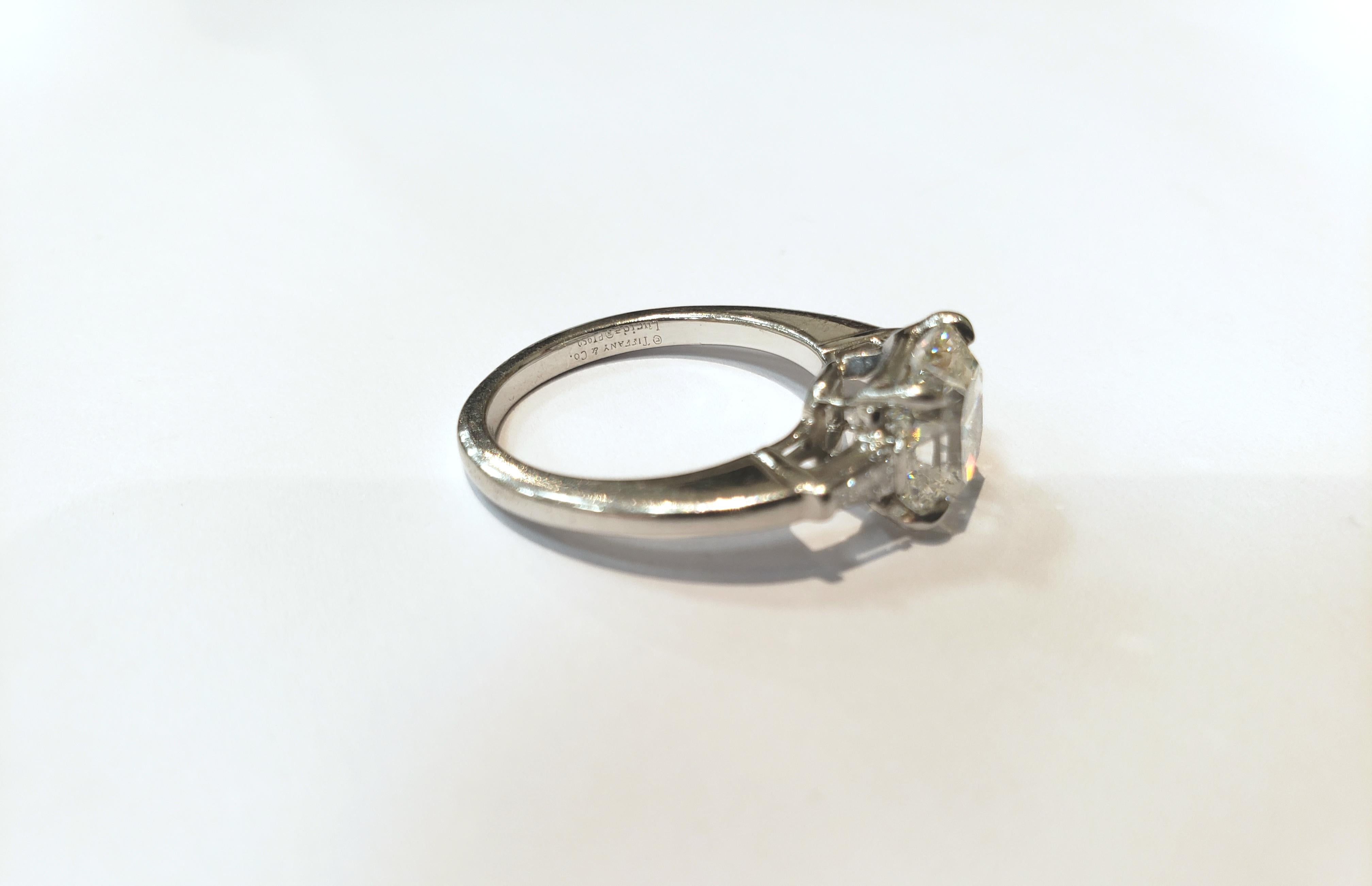 A Beautiful Internally Flawless, Cut Cornered Square Diamond Tiffany Engagement Ring, Set in Platinum, From The Lucida Collection.
Diamond is 2.31 Carats, Measuring 7.58 x 7.36 x 5.51 Millimeters.
 H Color, IF Clarity. Excellent Cut And Polish, Very