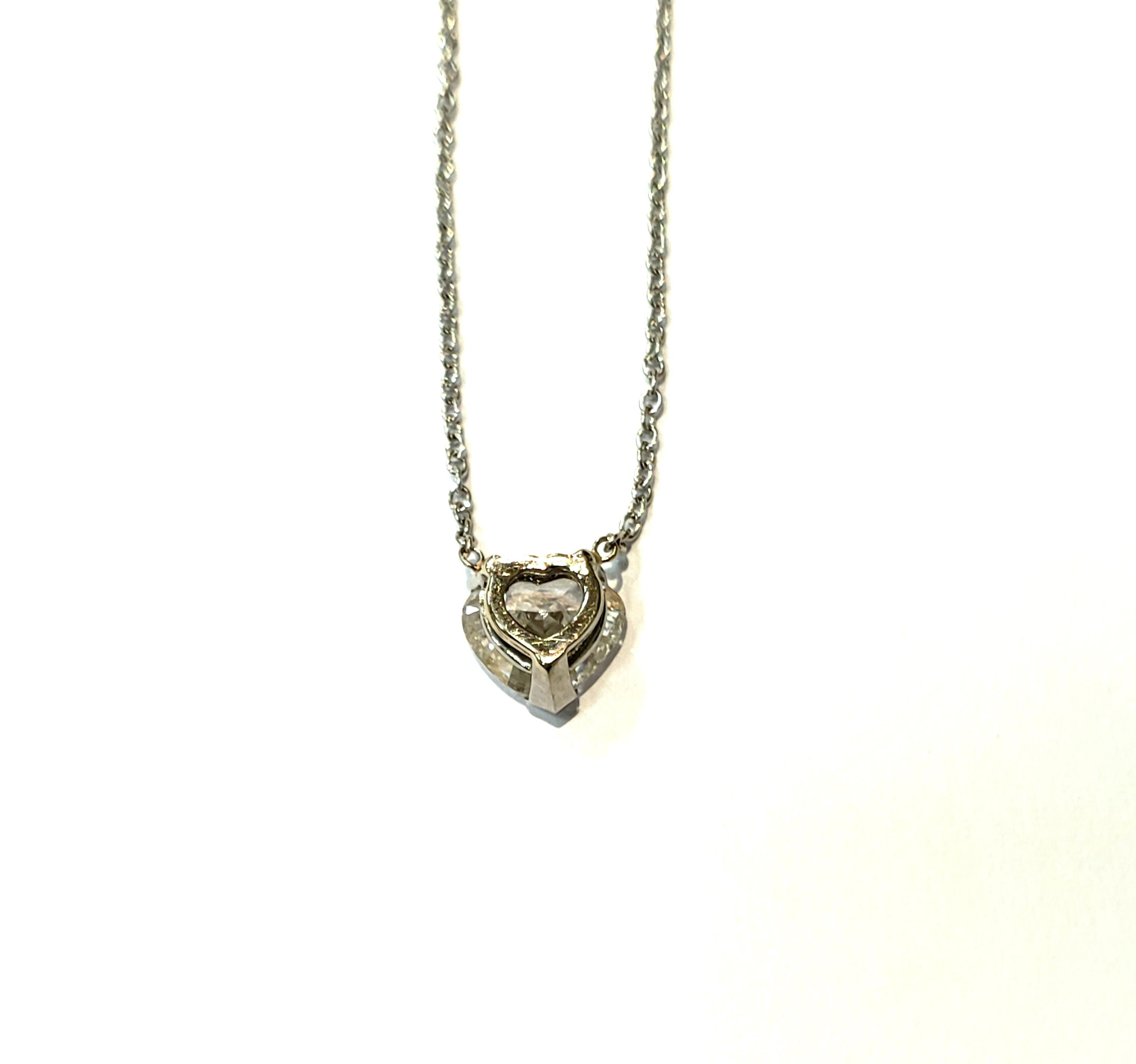 **LOWER PRICE**   A 1.95 Carat Heart Shaped Diamond Solitaire Pendant, Set in a Platinum Basket Mounting, Attached to a 1.3 Millimeter White Gold Chain. Heart Diamond is Approximately 1.95 Carats / F Color / VVS Clarity.
Necklace Measures 16