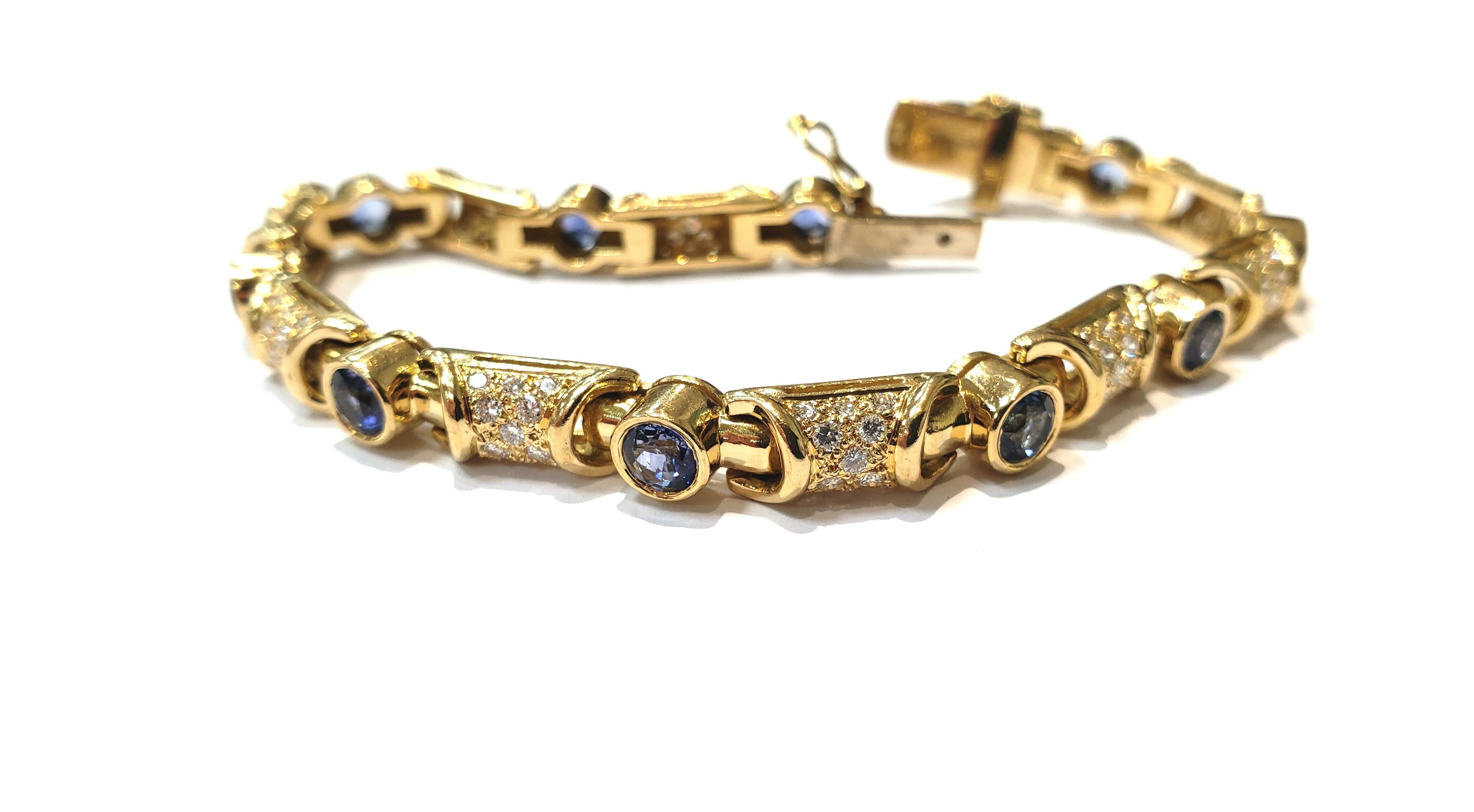 18 Karat Yellow Gold and Diamond Link Bracelet with Bezel Set Blue Sapphires For Sale 1