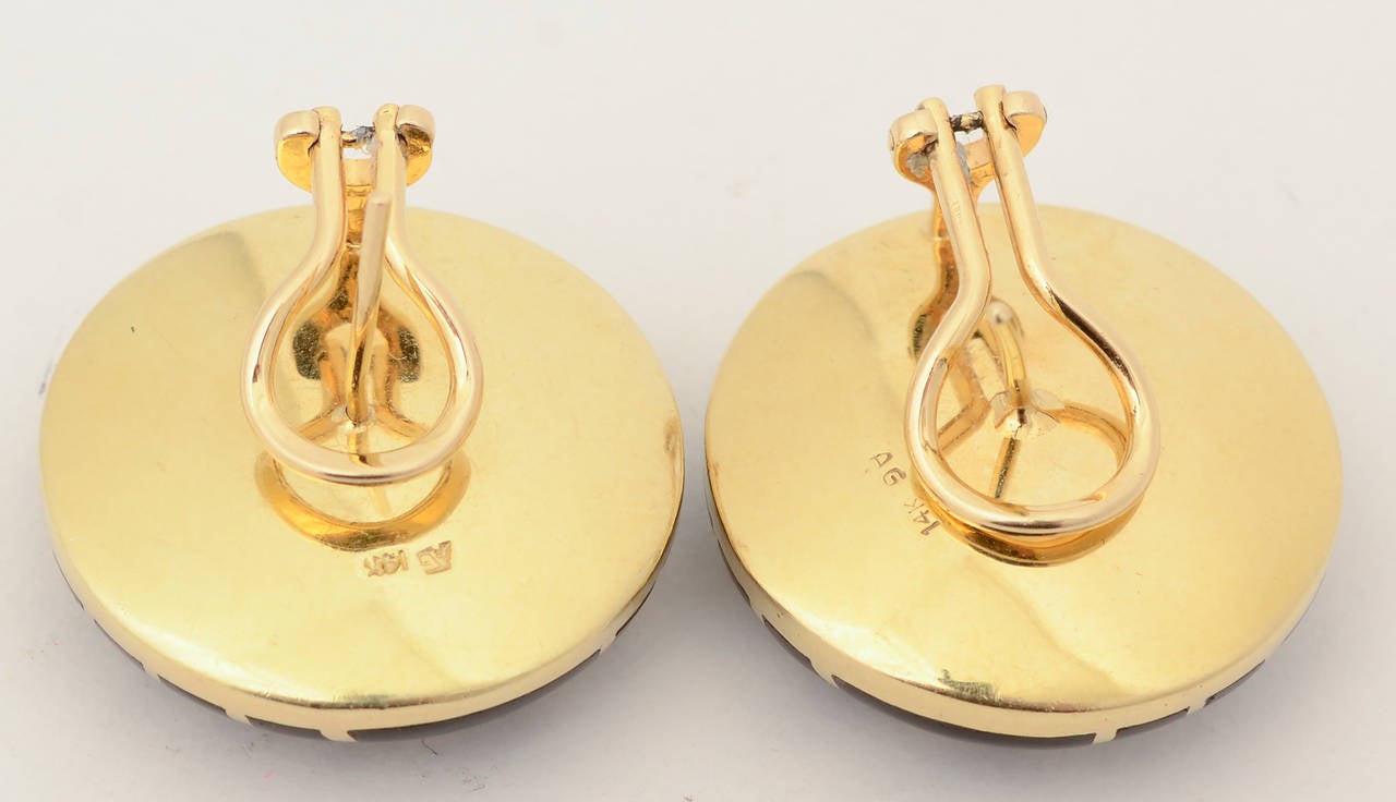 Asch Grossbardt latticework pattern earrings in black onyx set in 14 karat gold. The earrings have omega backs. They measure 1