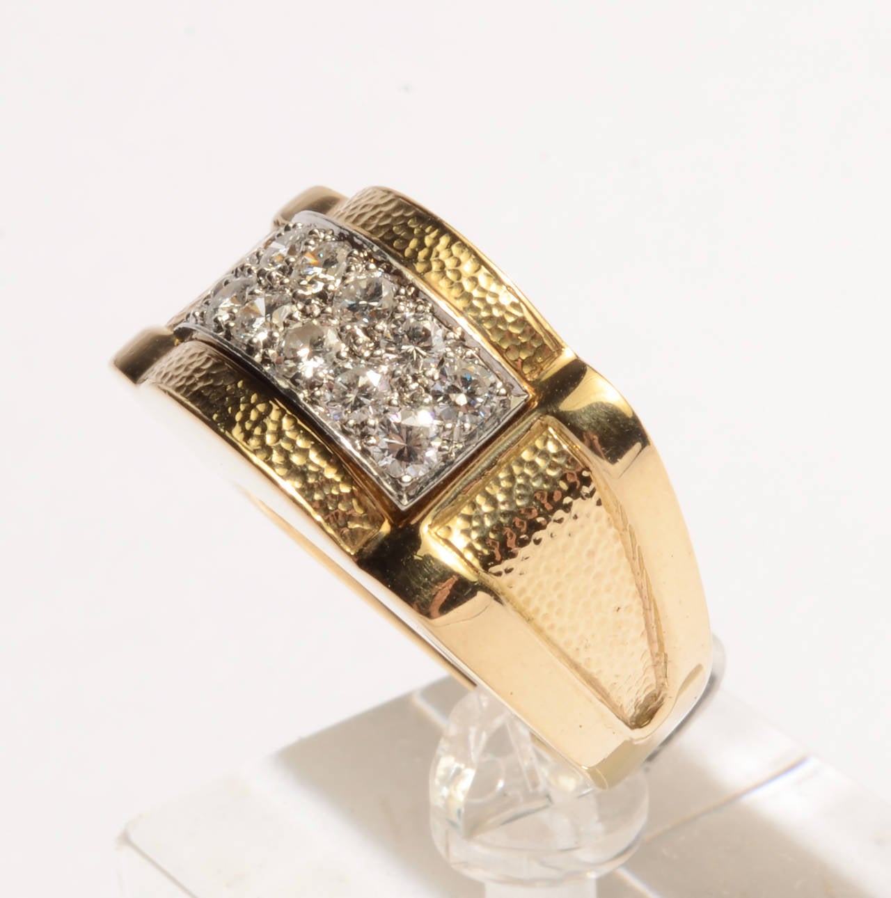 David Webb 18 karat gold ring with diamonds set in platinum. Hammered surfaces on top and sides with smooth finish front and back. Size 6 1/4 but can be sized up or down. Can be worn equally well by a man or woman. It measures 7/8
