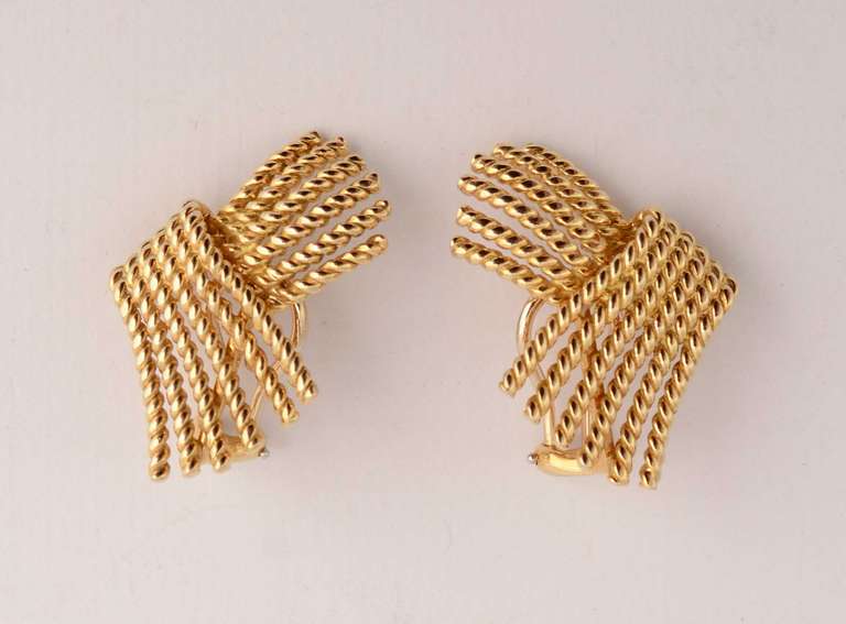 Classic earrings by Schlumberger for Tiffany of 18 karat twisted rope forming a V shaped spray. Measurements are 3/4