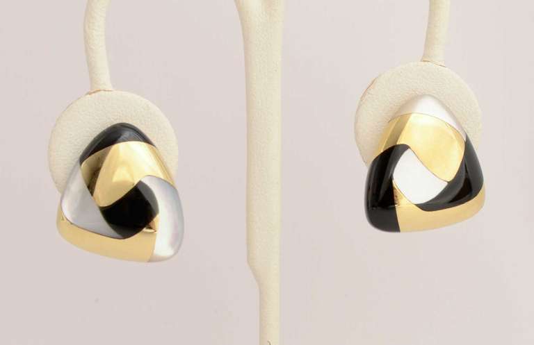 Unusual Tiffany and Co. triangular earrings with a mosaic design of gold; onyx and mother of pearl. Measurements are 1