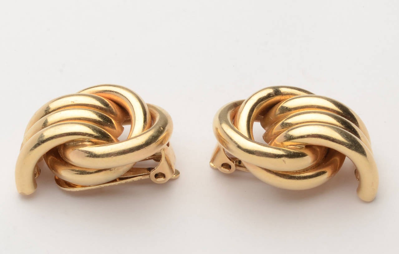 Classic Retro era 14 karat gold earring. Two groups of circles are at right angles. Clip backs; measurements are 1 1/16