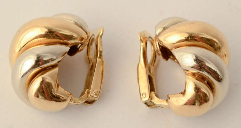 Classic shrimp earrings but with a twist - literally. Made of 18 karat yellow and white gold. Clip backs, measuring 3/4