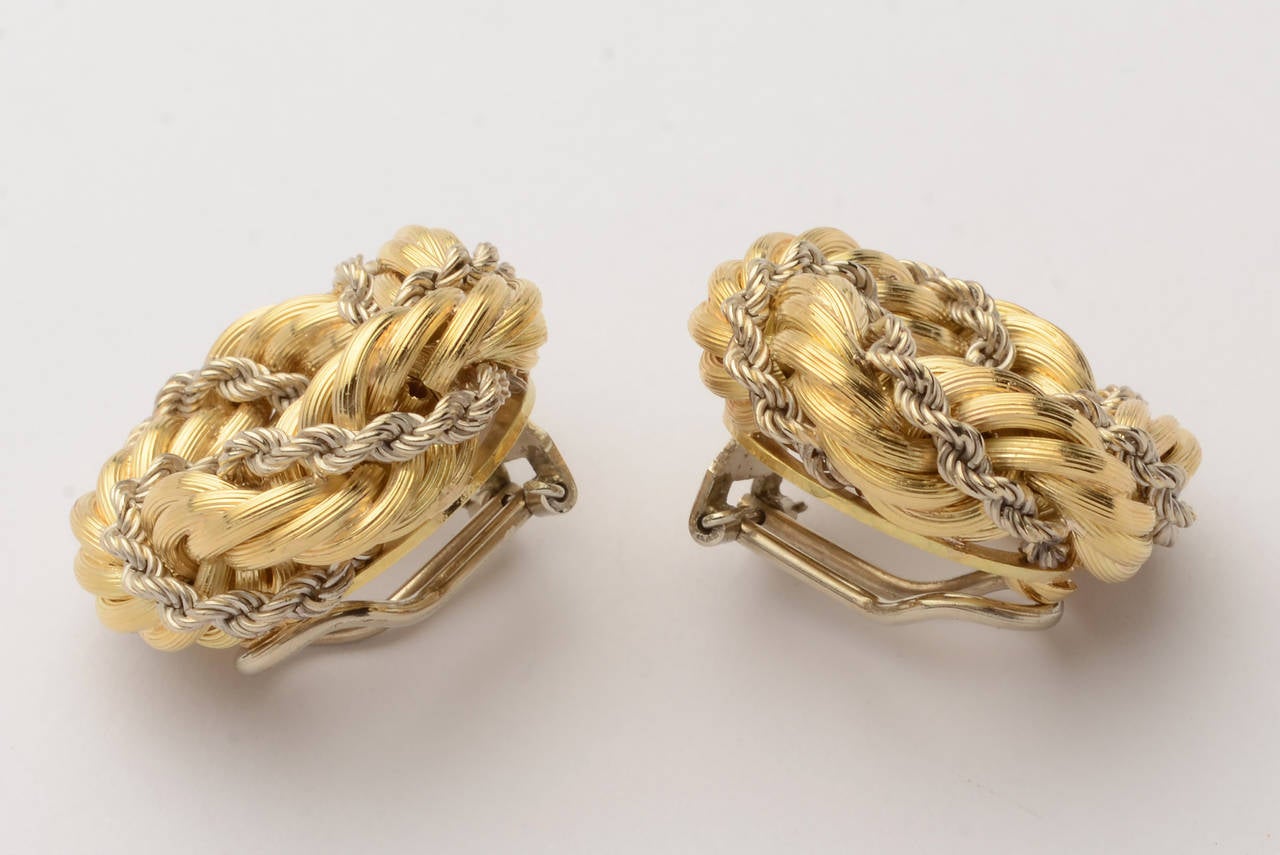 Classic rope twisted design earrings in yellow and white 18 karat gold. Clip backs can be converted to posts. They measure 1