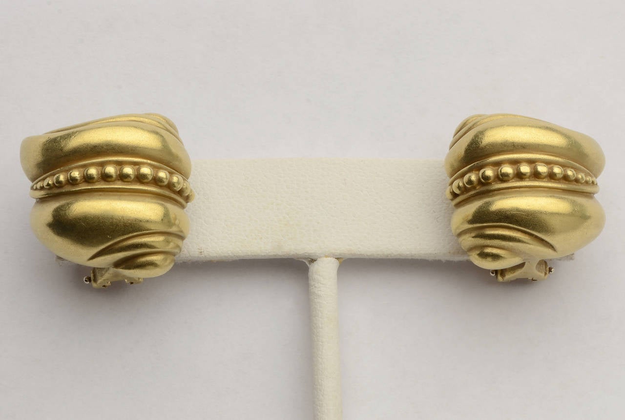 Classic Kieselstein caviar design earrings in his signature matte green gold. Omega backs; dated 1981.