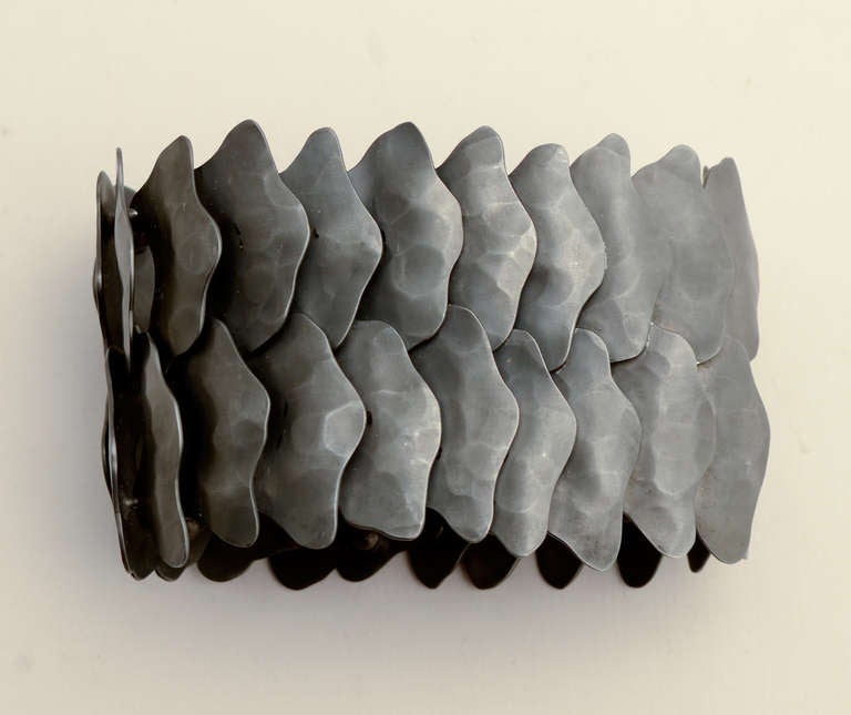 Dramatic, sinuous bracelet by Mexican architect turned jeweler, Eduardo Herrera. He oxidizes the surface of the 950 silver (higher quality than sterling) to create the black surface. The bracelet measures 7 3/4