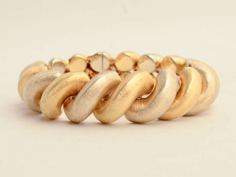 Florentine finish Torchon bracelet by Buccellati in 18 karat yellow and white gold. It is 3/4