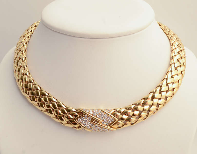 Van Cleef and Arpels braided 18 karat gold choker necklace centered with diamonds. The colorless VVS quality stones weigh a total of about 2.5 carats. The necklace is 5/8