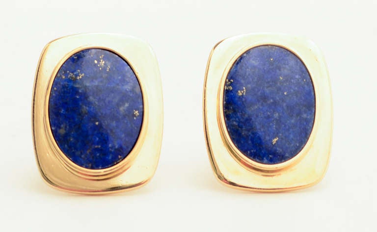 Handsome lapis lazuli cufflinks with large oval stones. The 14 karat gold frame measures 1