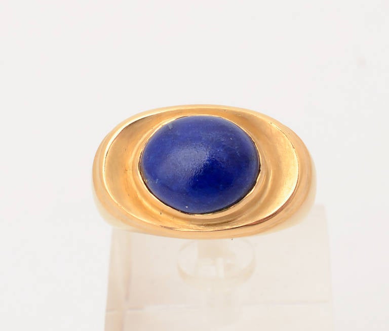 Strong design 22 karat gold ring with a richly colored lapis lazuli stone. It is size 7 1/2 but can easily be sized up or down. The front of the ring is 9/16