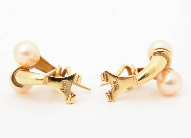 Women's Pearl and Gold Crossover Earrings For Sale