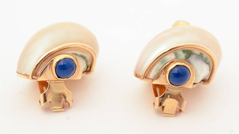 Classic Seaman Schepps shell earrings terminating in emerald and lapis lazuli stones. Measure 1 1/8