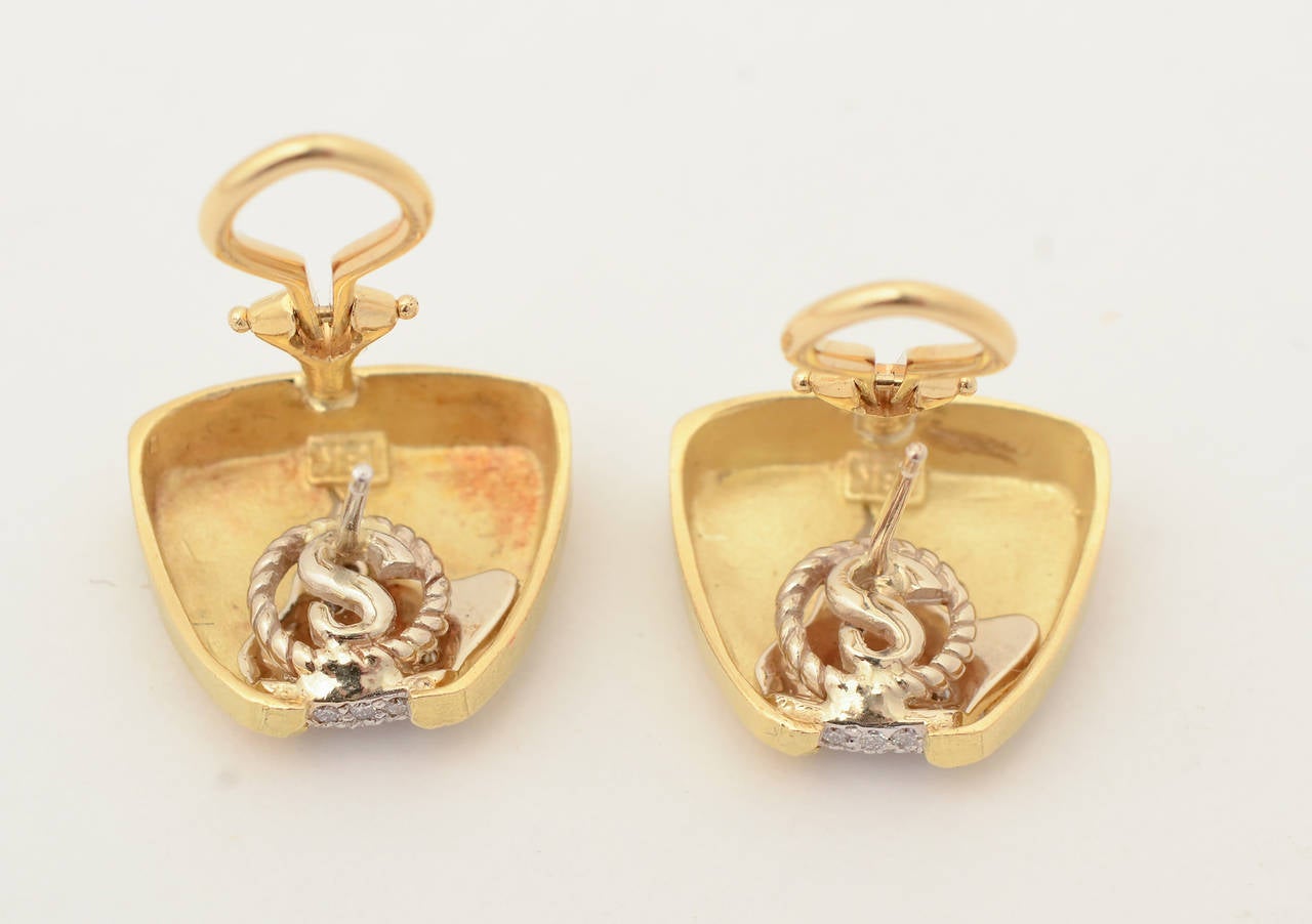 Beautiful 18 karat gold with diamonds earrings by SeidenGang. The diamonds appear to emerge from the irregularly shaped  opening of the mottled gold surface. Bottom measurement is  5/8