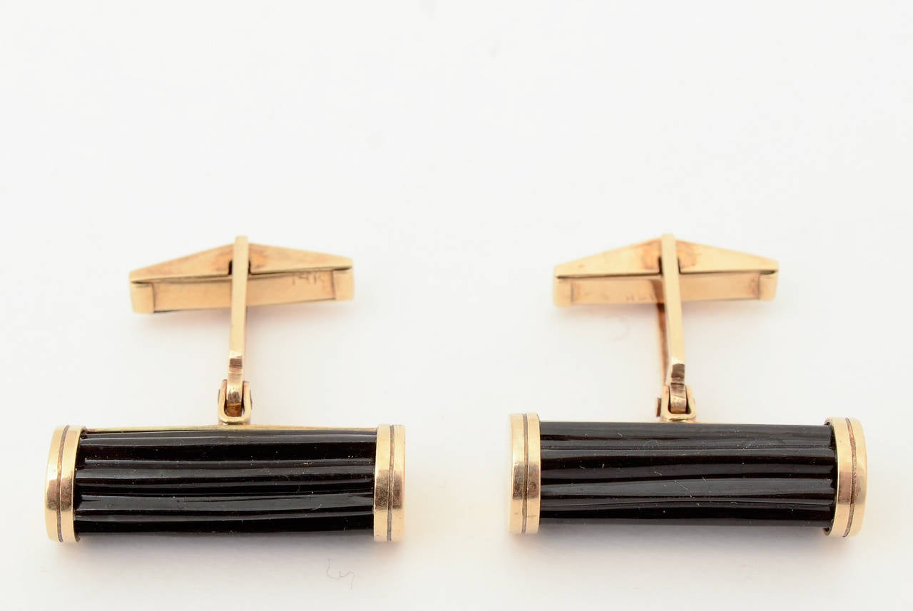 Black onyx barrel shaped cufflinks with a nice ridged pattern to the stones. They measure 1