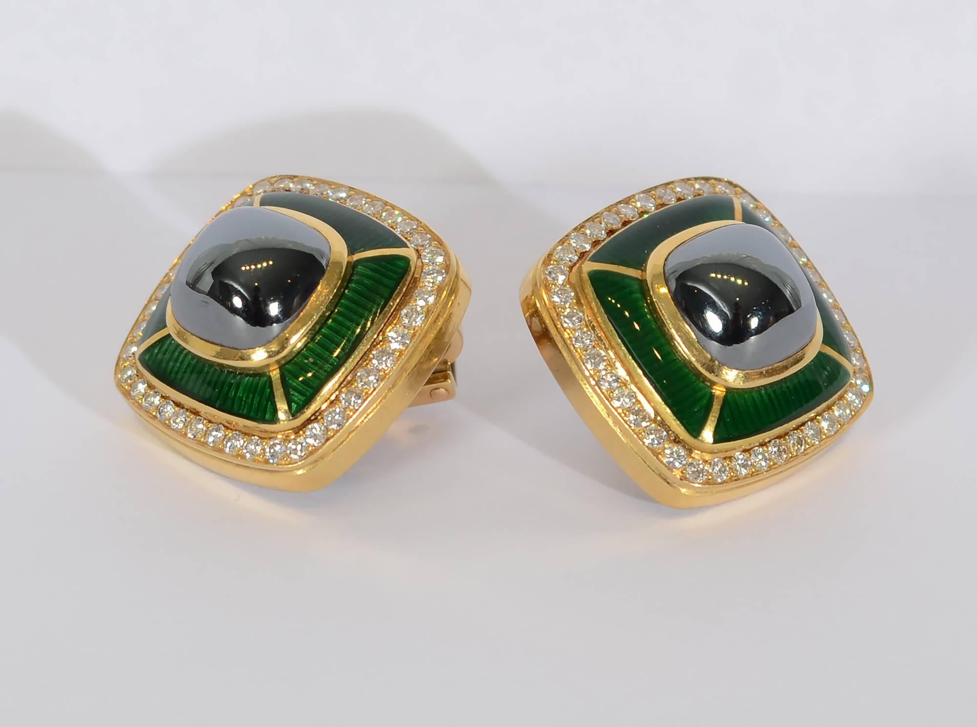 Sophisticated and elegant Tiffany earrings with a hematite center surrounded by green enamel and diamonds. The green and gray are an unusual, very wearable color combination.The earrings measure 1