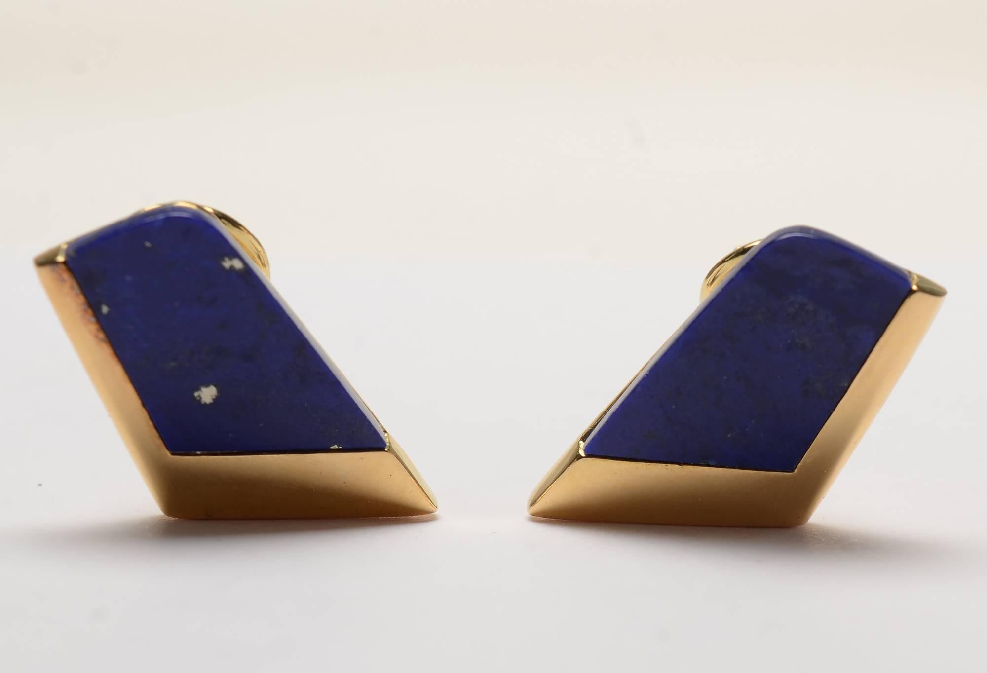 Trim and  tailored trapezoidal shaped earrings of lapis lazuli set in 18 karat gold. They have a maker's mark of the letter L within a triangle, a mark with which I am not familiar. Measurements are 7/8 long x 1/2