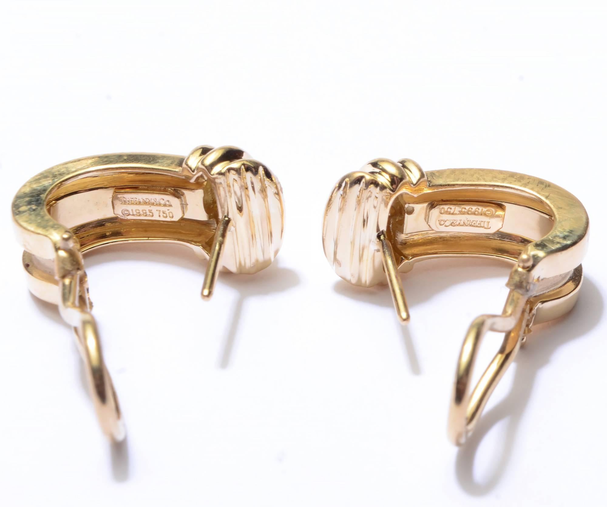 Medium size oval hoop earrings by Tiffany and Co. They measure 3/4
