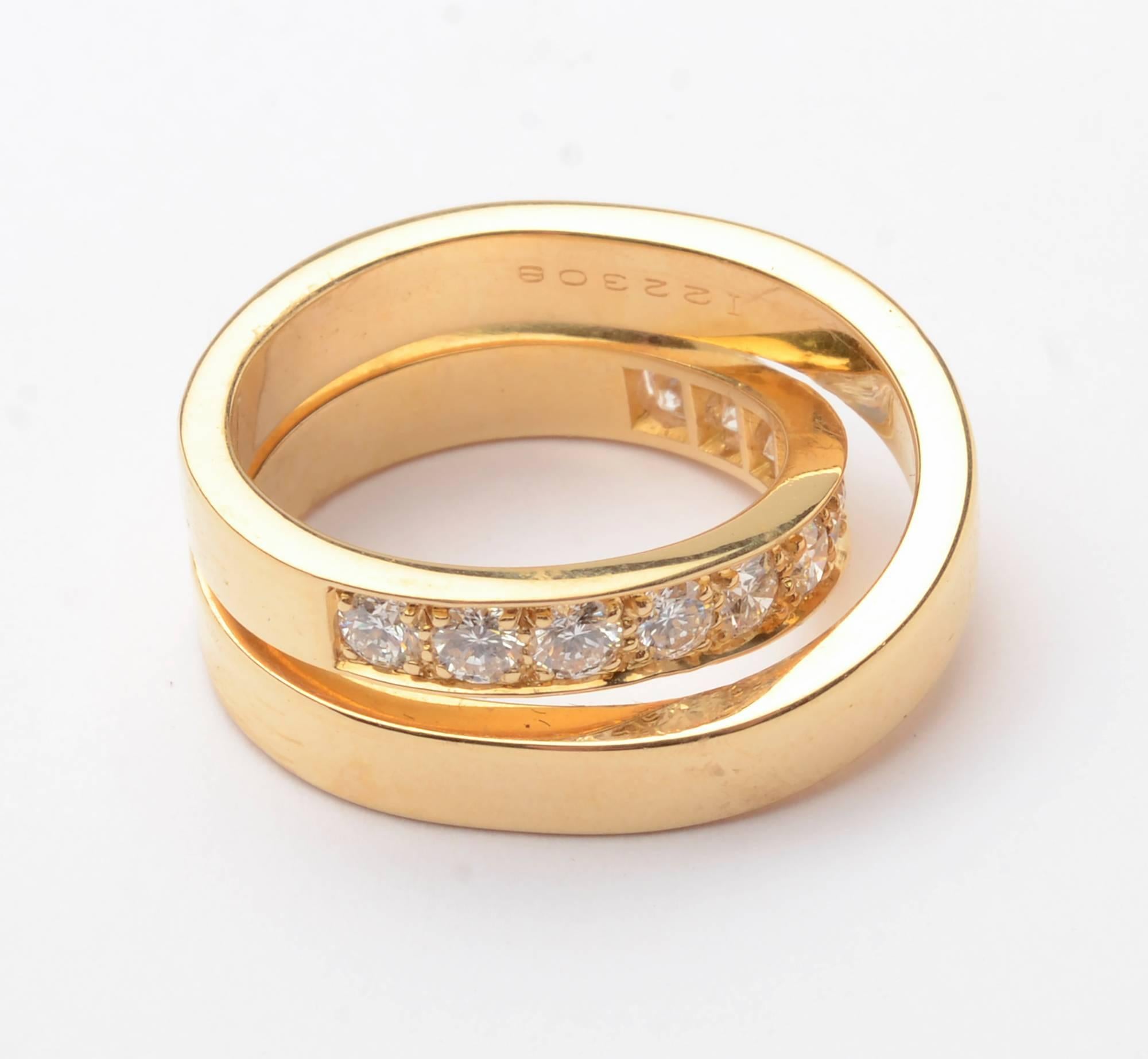 Cartier Nouvelle Vague crossover ring in yellow gold. It has 12 VS diamonds weighing a total of 1.2 carats. Ring is size 6 3/4 but can be sized up or down.