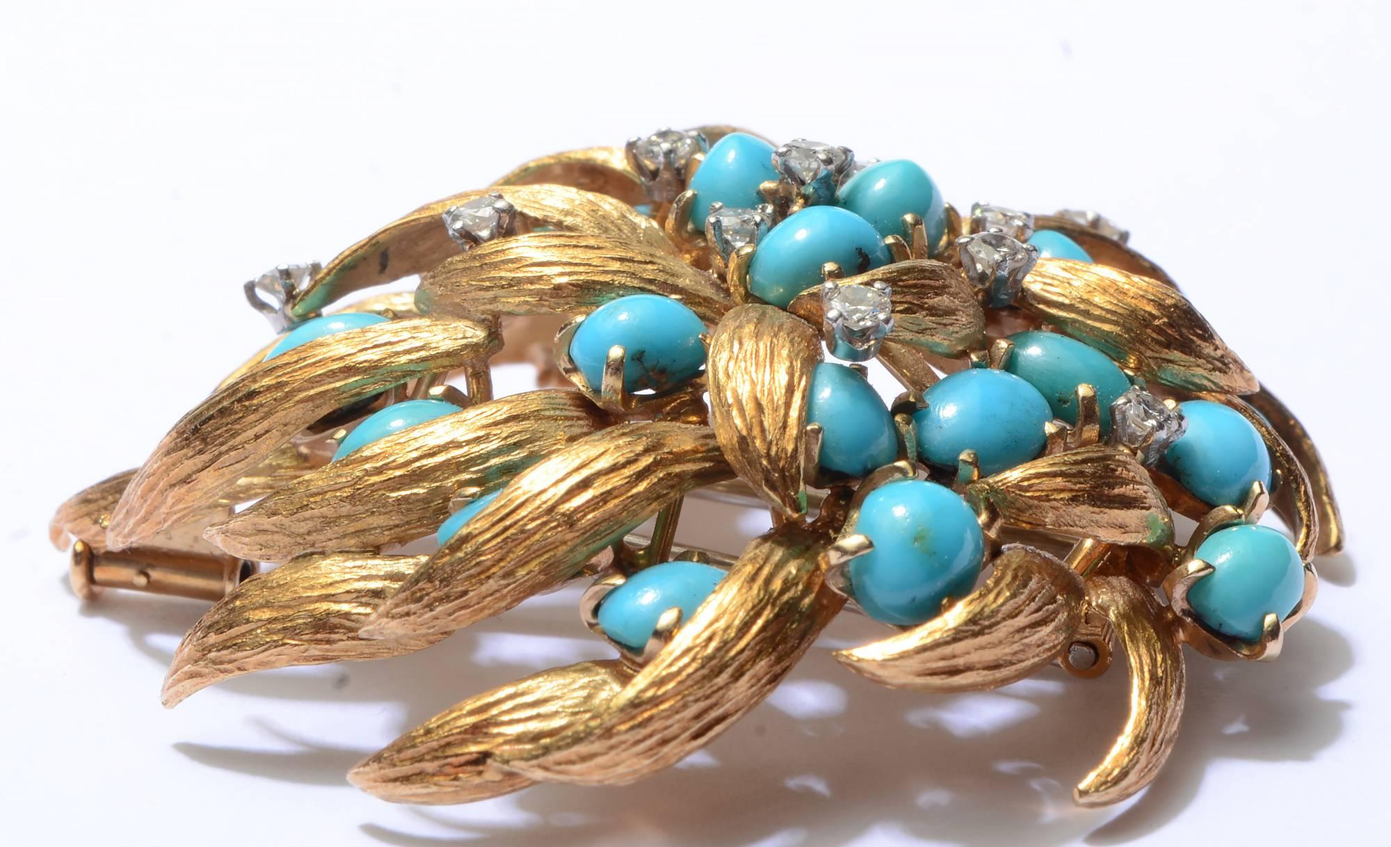 Cascading petals are interspersed with turquoise and diamonds in this graceful flower brooch by David Webb. Made circa 1960; excellent condition.