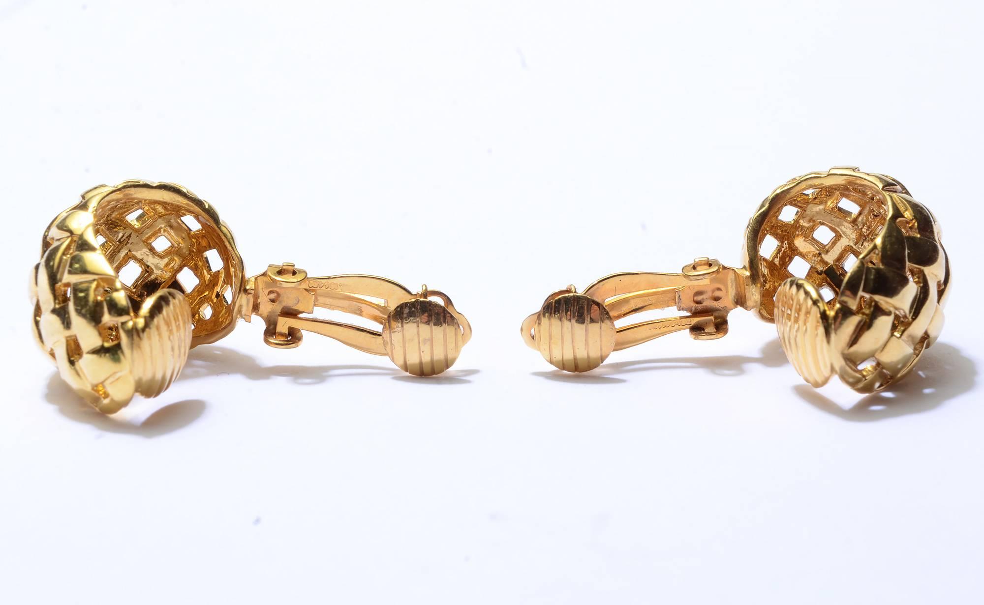 These basket weave hoop earrings are the perfect wear everywhere piece of jewelry. They are substantial in size but lightened by the open work design. Measurements are 1