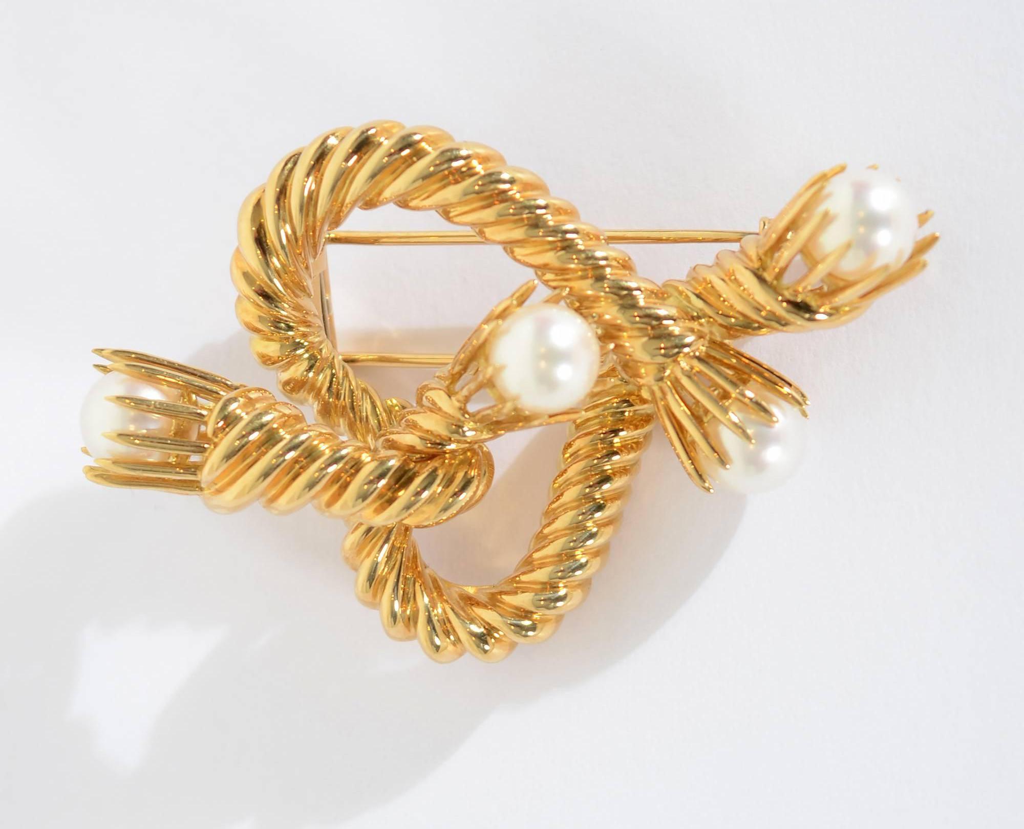 Wonderful abstracted heart brooch by Jean Schlumberger for Tiffany of twisted gold rope terminating with pearls.Schlumberger was known as 