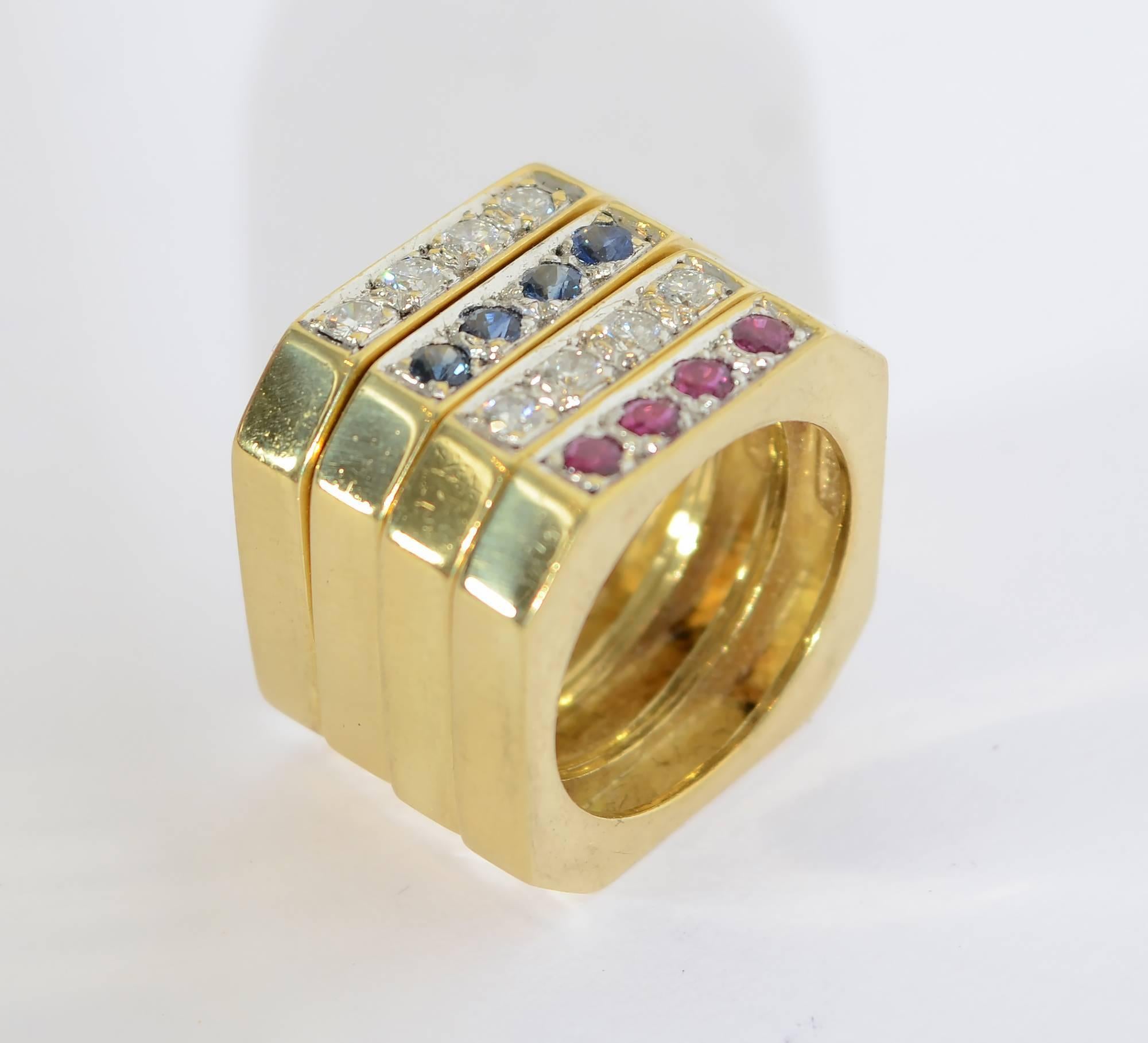 Set of four octagonal shaped stacking rings by David Webb. Two of the rings have diamonds; one is set with rubies and one with sapphires. They are wonderfully versatile in that they can be worn in multiple combinations. The rings are size 6.