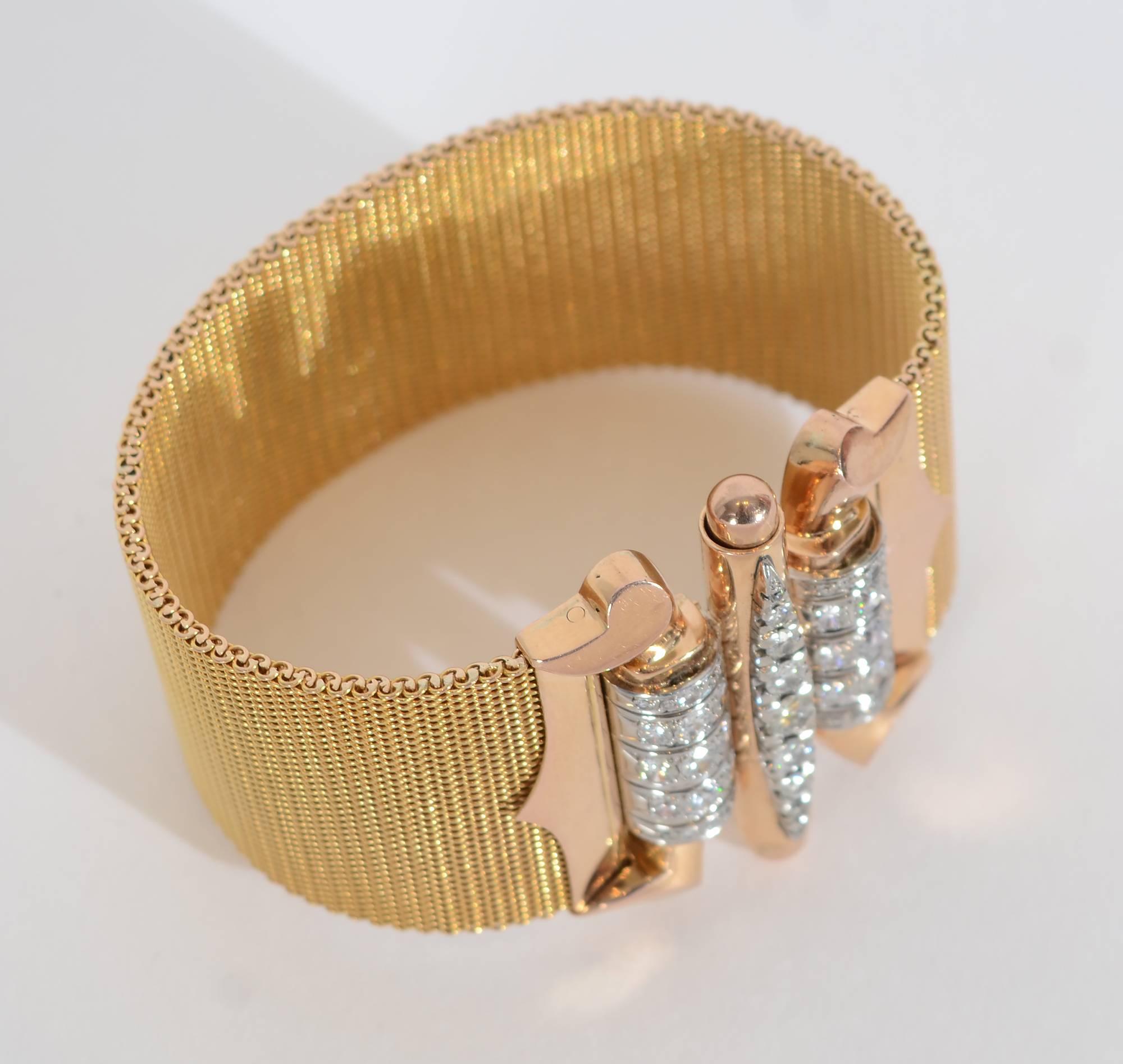 This glamorous 18 karat gold bracelet makes a stunning Retro statement. It is made of very intricately woven tiny links of yellow gold. The buckle is rose gold with four carats of diamonds. The bracelet is 7 inches in length. The body of the