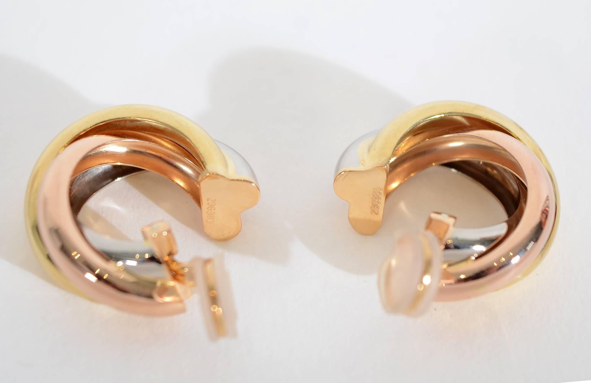 Cartier tricolor gold hoop earrings in a size no longer in production. They measure 7/8