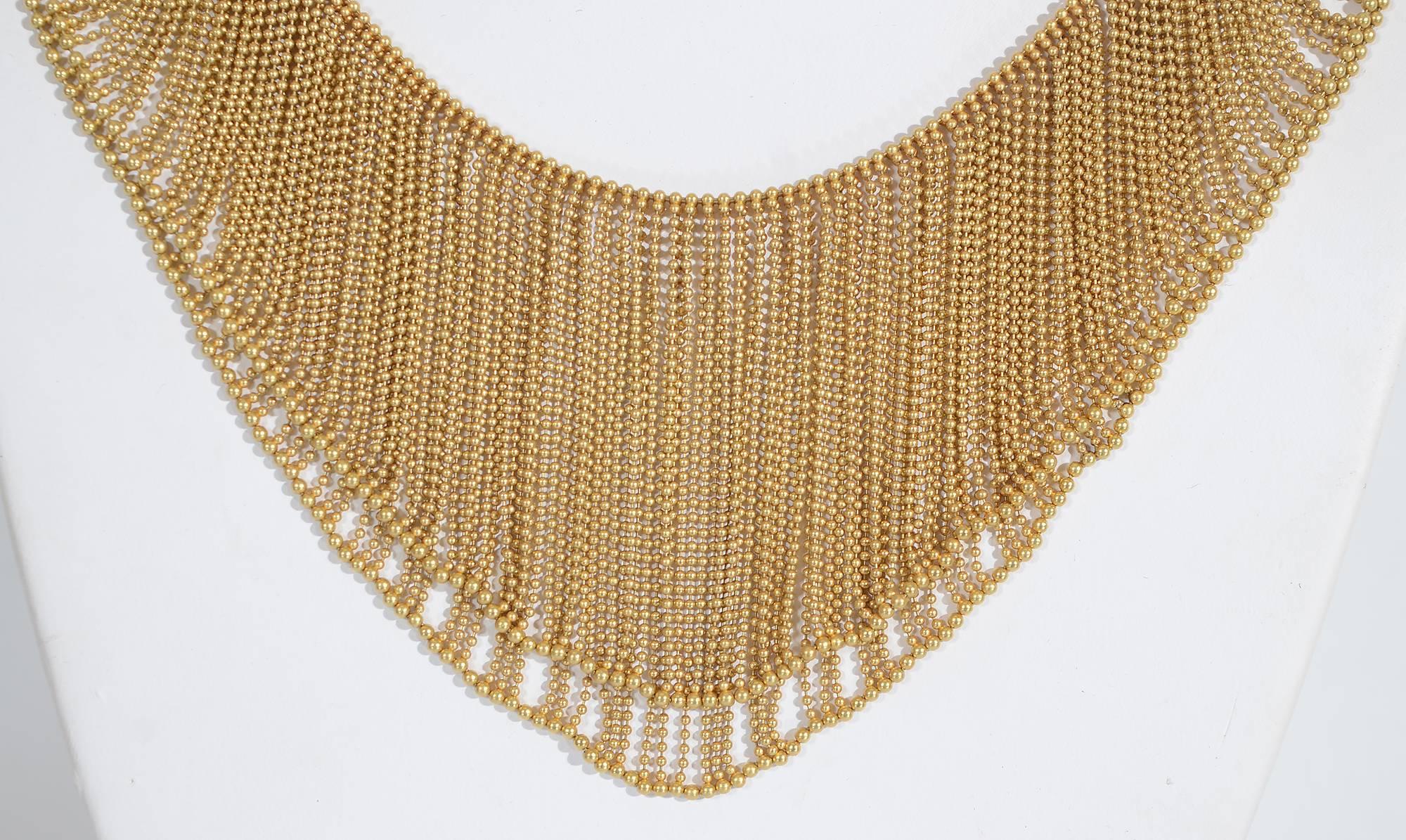 This two layer H. Stern necklace of tiny, tiny gold beads is sensuous in look as well as feel. The double layers overlap at the clasp and then one becomes longer than other. At the clasp, the necklace is 7/16