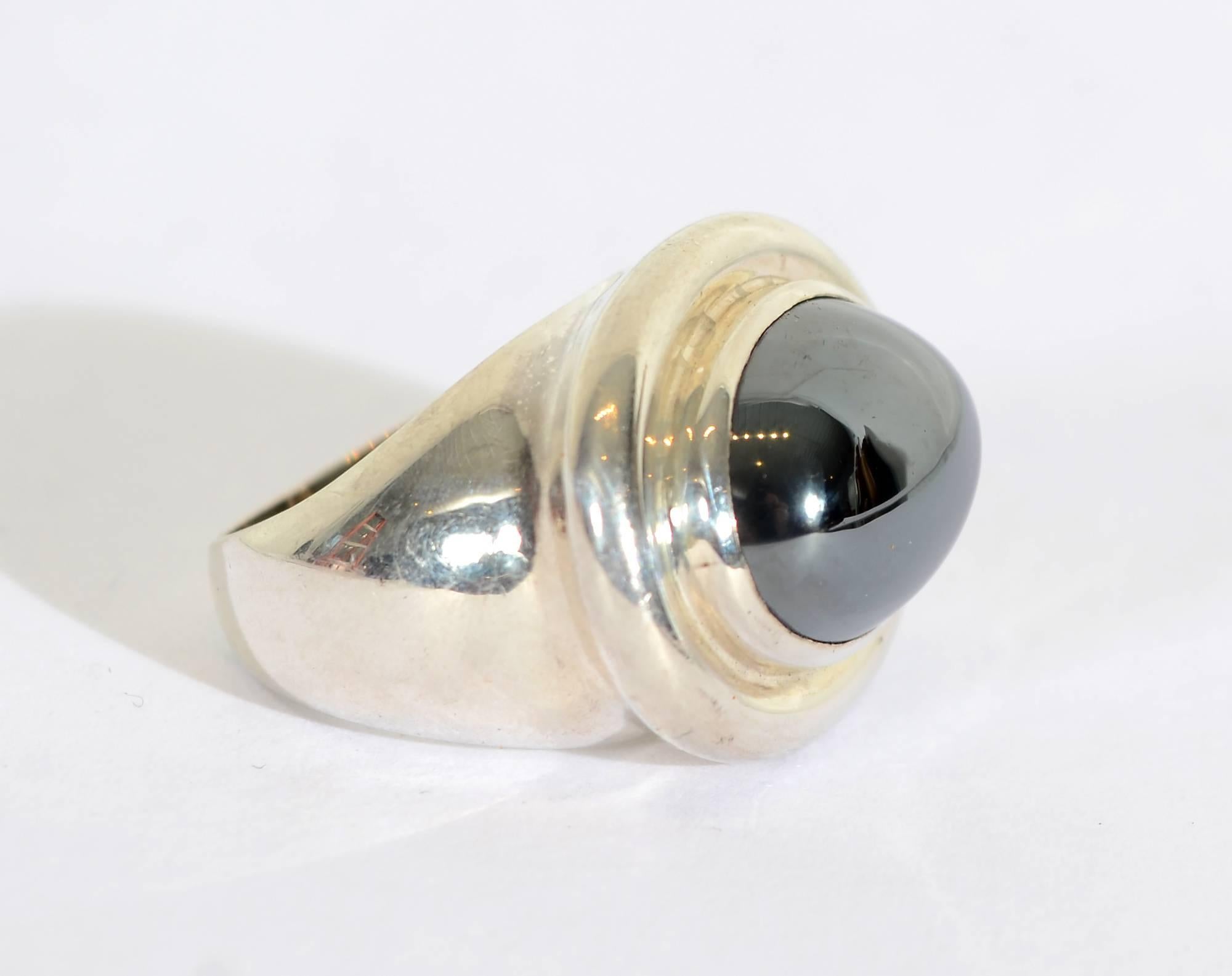 Streamlined and bold sterling and hematite ring by Paloma Picasso for Tiffany. The hematite is gray/black in color. The matching earrings are dated 1985 so I assume these are of the same period. They are available as item LU1332282753. The ring is