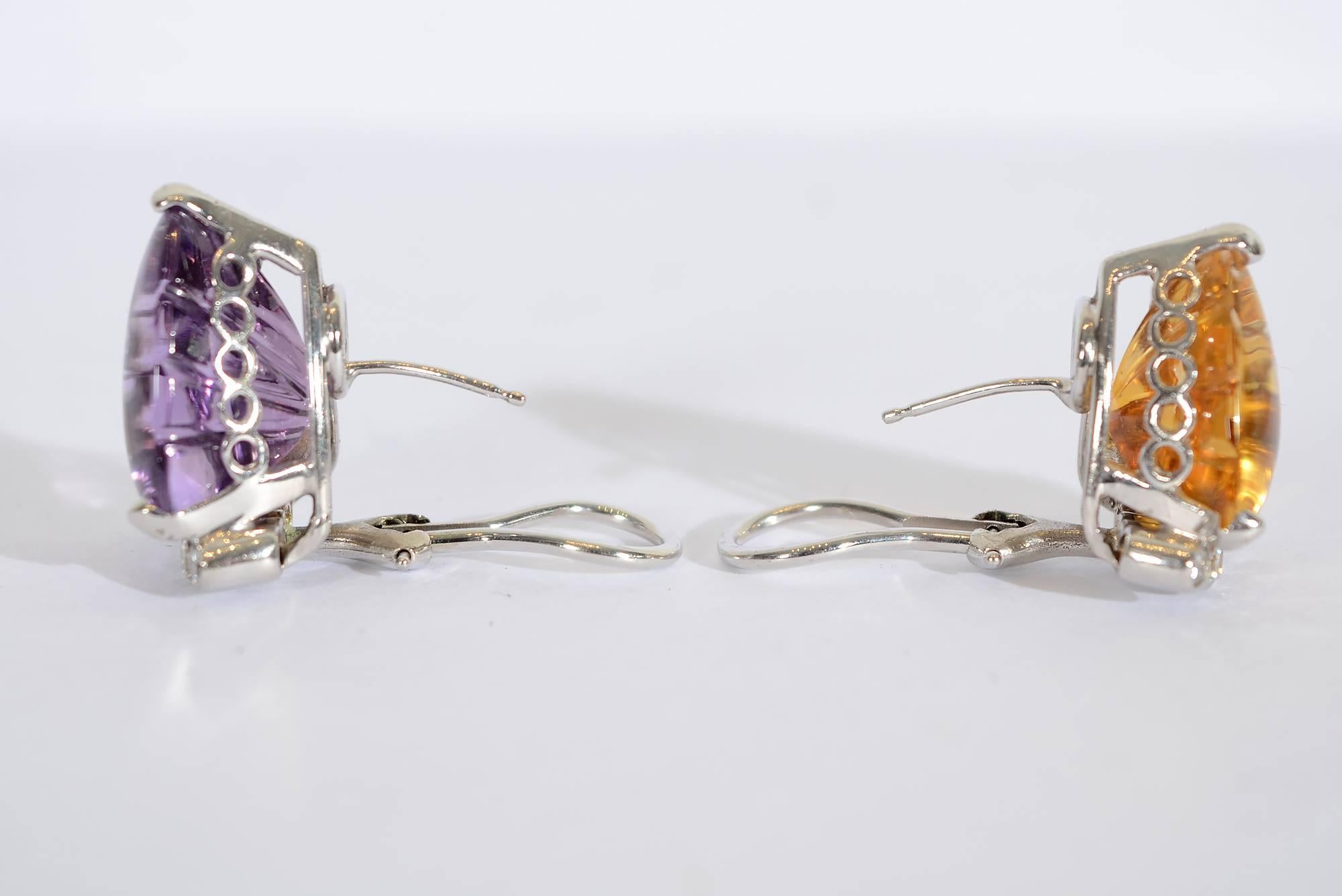 The whimsical yet elegant earrings by Cellino are fraternal twins. One has an amethyst and the other a citrine. Both have 6 round diamonds at the bottom. The amethyst is a slightly larger stone. It measures 3/4