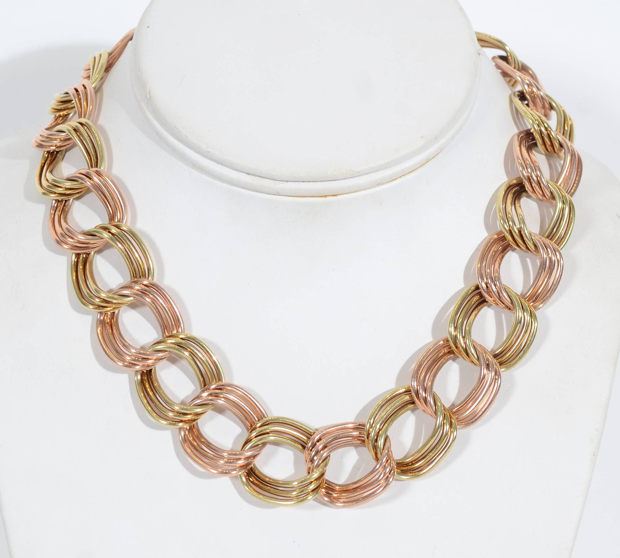 This Tiffany necklace of triple links alternating yellow and pink gold is as stylish today as when it was made in the 1940's. The necklace is 16 inches long. The links are 3/4" in width. The necklace weighs a substantial 129 grams.