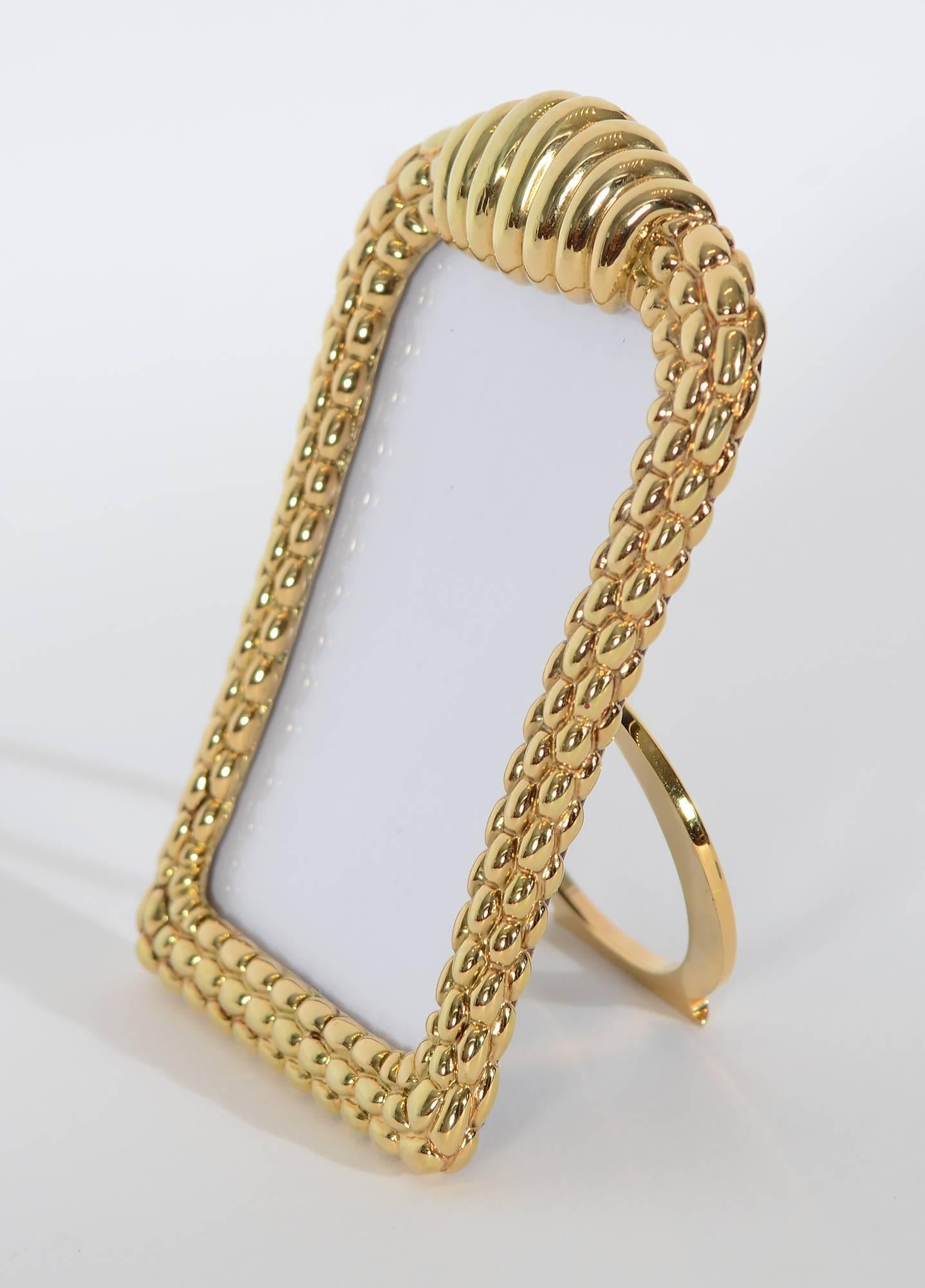 How better to remember a special  person or event than in this elegant gold picture frame by Fope Gioielli?  Fope has been creating fine jewelry in Venice since 1929. The sculptural design of this frame is much like the link bracelets for which they