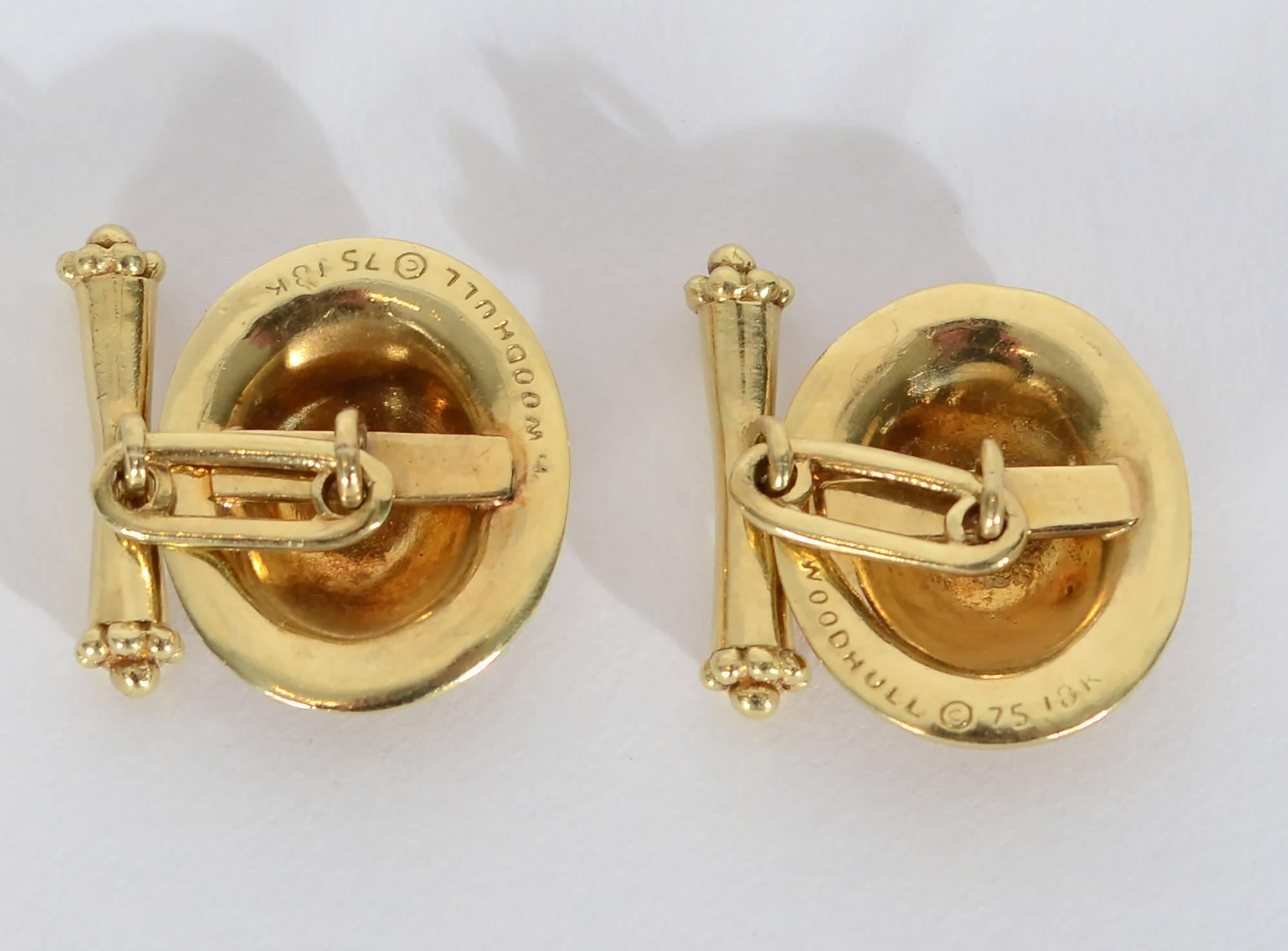Oval cufflinks with a frame of gold balls by New York's late jewelry designer, Helen Woodhull. In addition to having her own ateliers, at various times Woodhull designed for Cartier; Tiffany and Georg Jensen. She died in 2005.
Much of Woodhull's