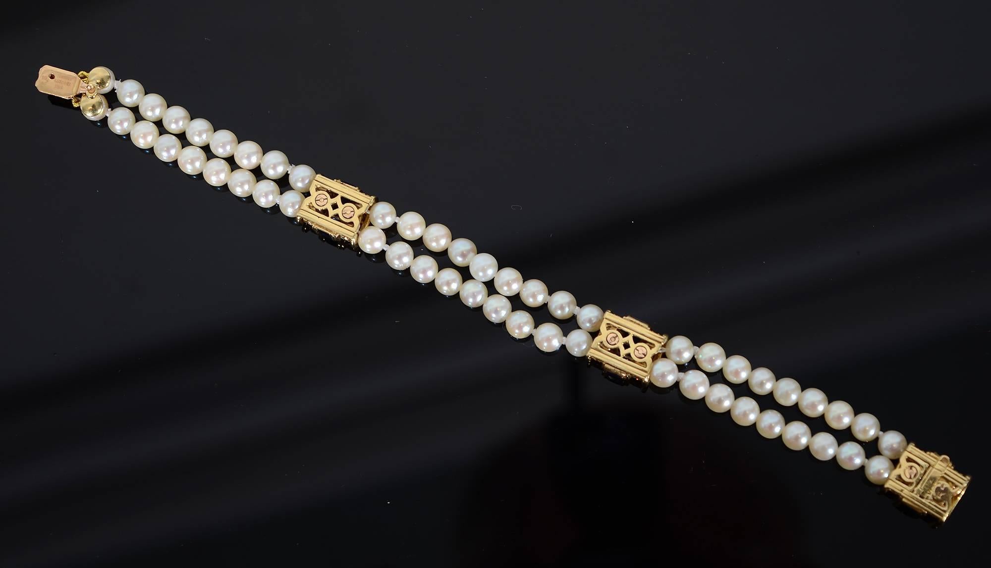 Tailored and elegant pearl bracelet with three bands of sapphires flanked by diamonds The pearls are approximately 5.5 mm. Length of the bracelet is 7 1/8 inches. It is half an inch wide. Made by Tiffany and Co. in France; circa 1960.